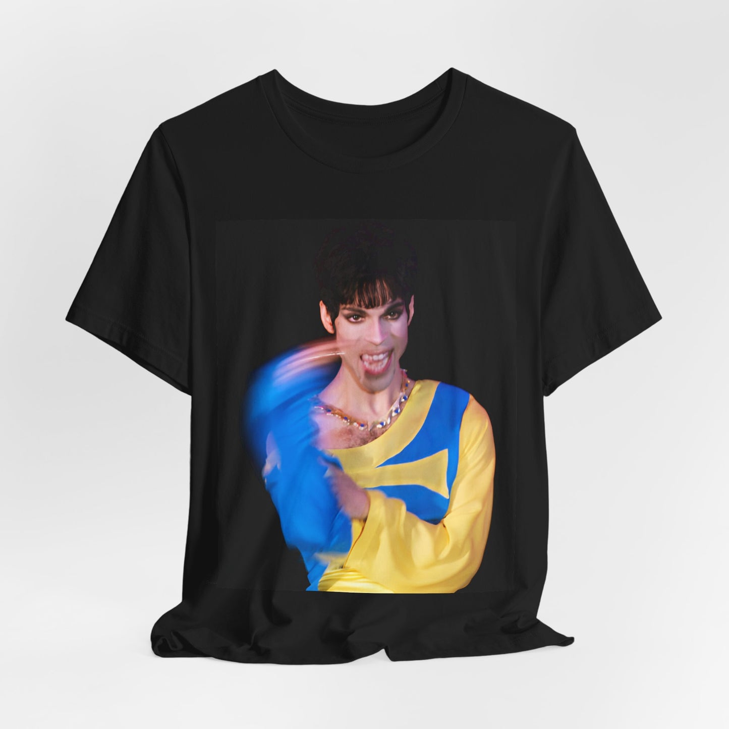 A black graphic t-shirt featuring a graphic related to Prince's 'When Doves Cry' song or era.