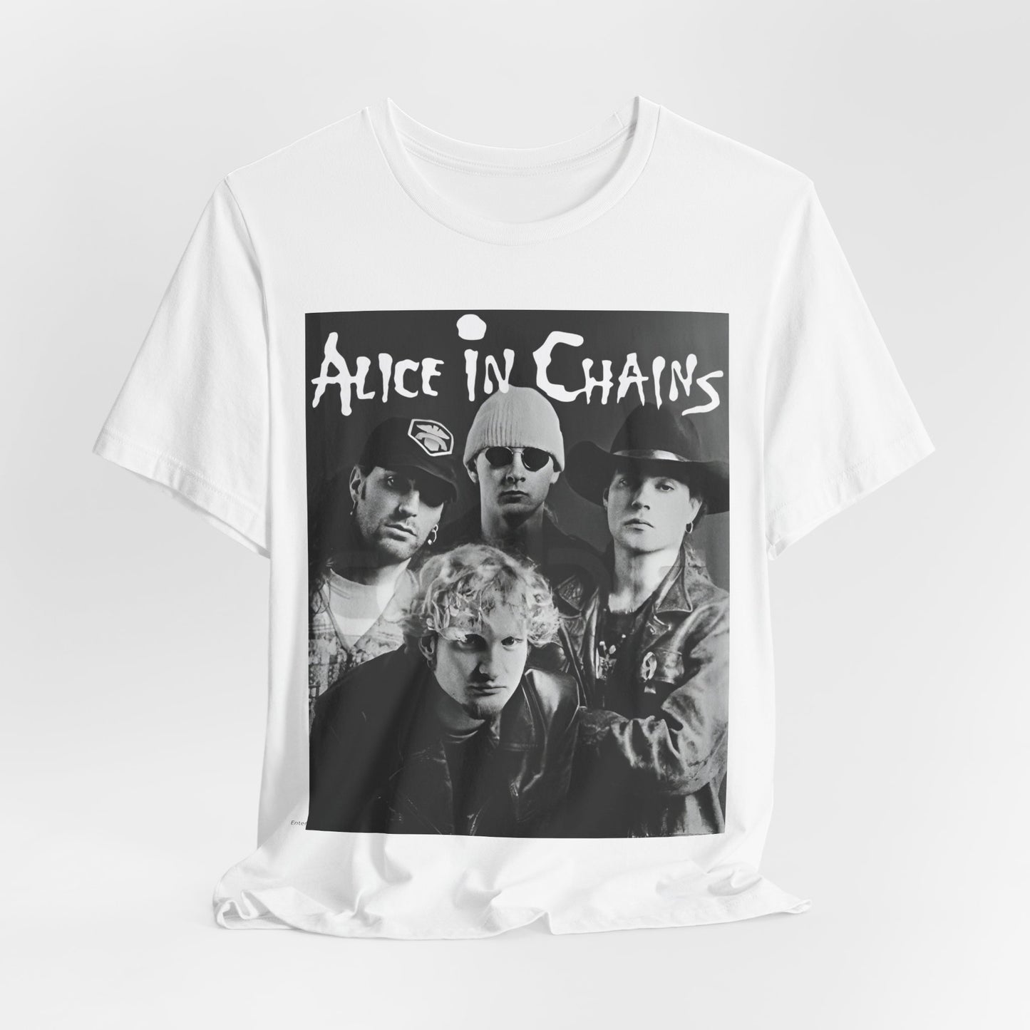 A black graphic t-shirt featuring a black and white photographic portrait of the band Alice In Chains, capturing their iconic grunge look.