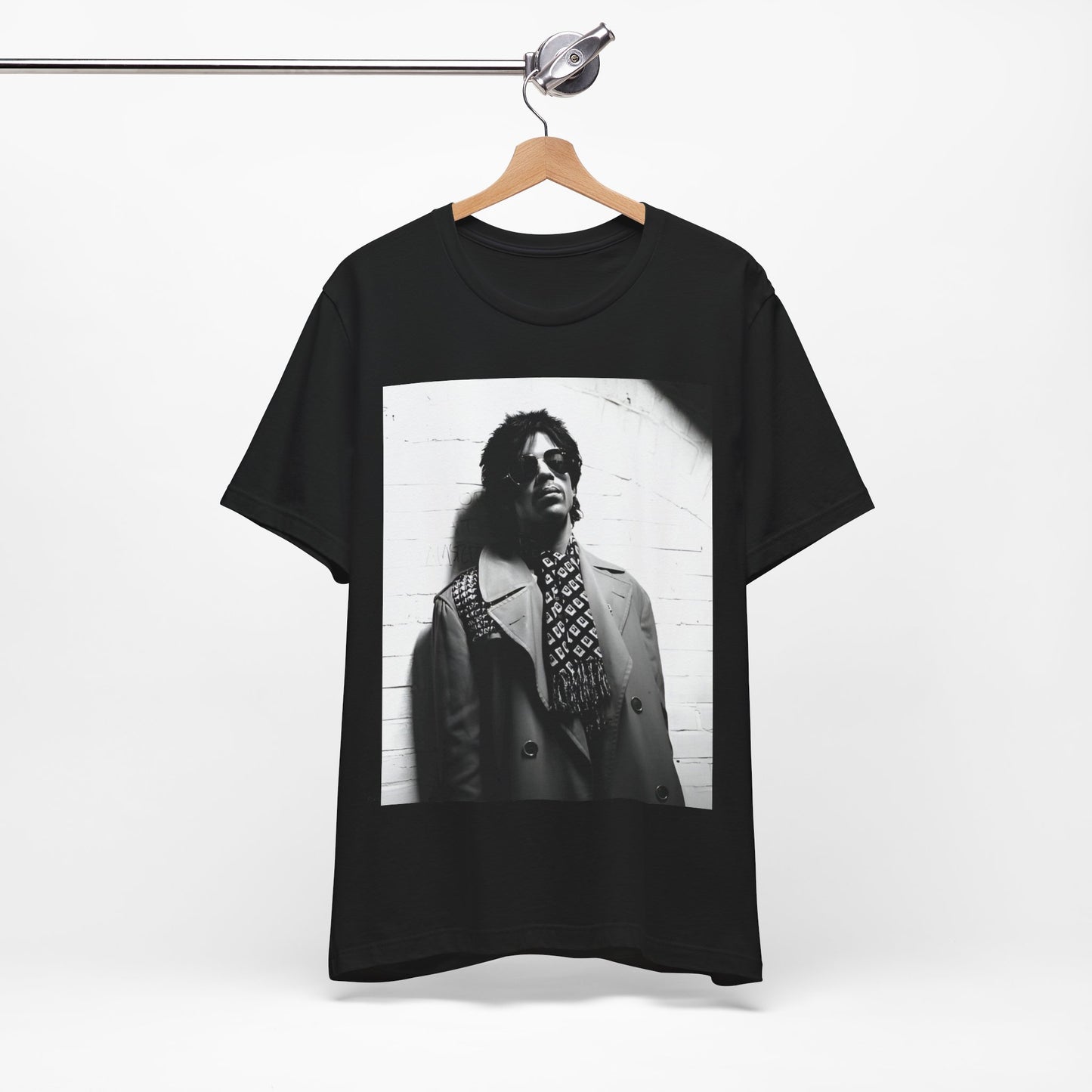 A black graphic t-shirt featuring Prince's iconic symbol, representing 'The Artist Formerly Known As'.