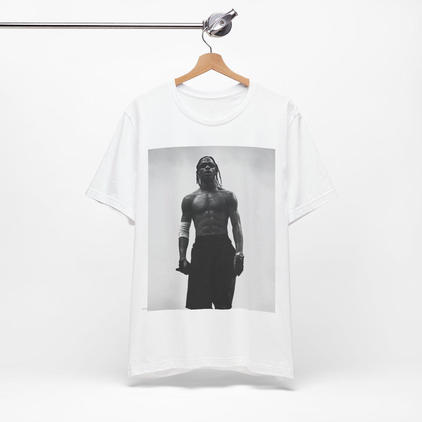 A black graphic t-shirt featuring a black and white portrait photo of Travis Scott.