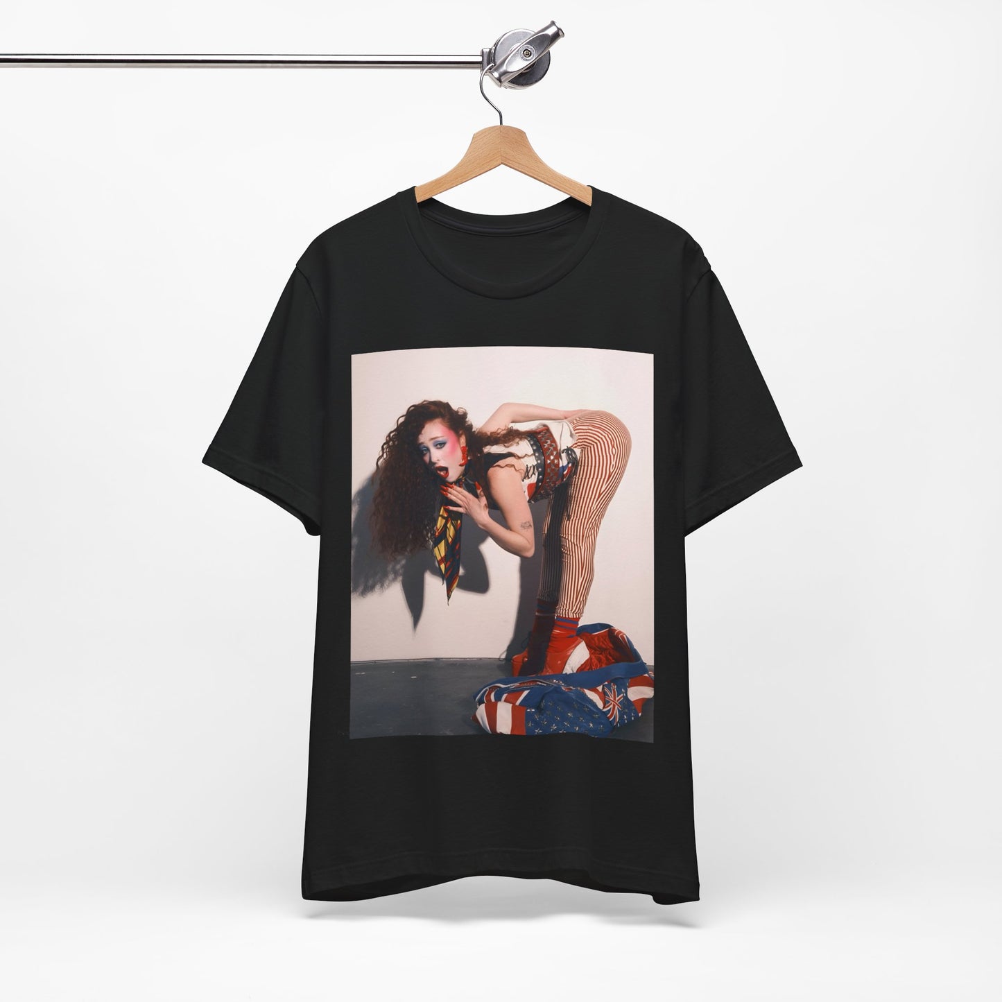 A black graphic t-shirt featuring a graphic of Chappell Roan with a 'Hot to Go!' theme, emphasizing her drag icon persona.