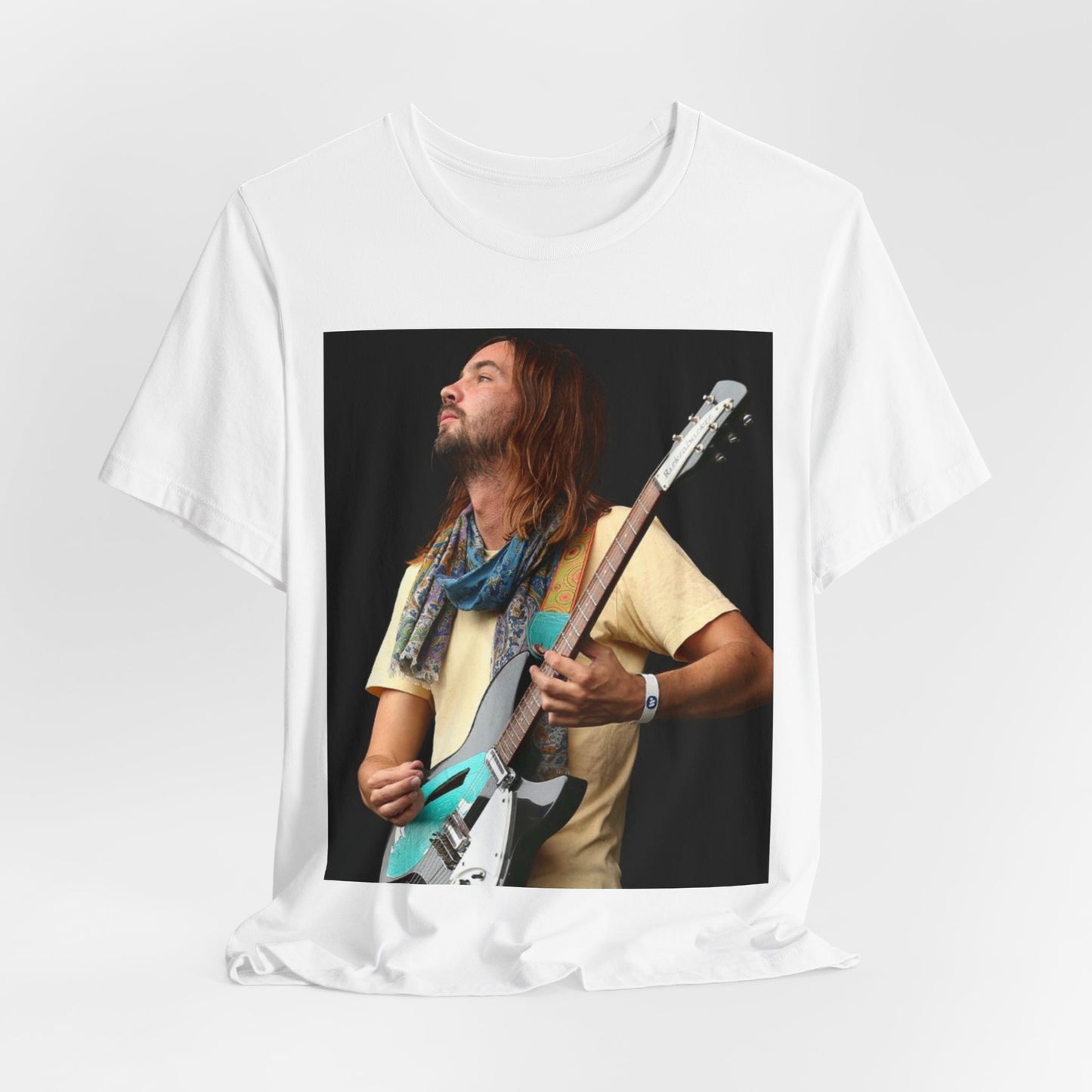 A black graphic t-shirt featuring a vintage indie rock graphic of Tame Impala.