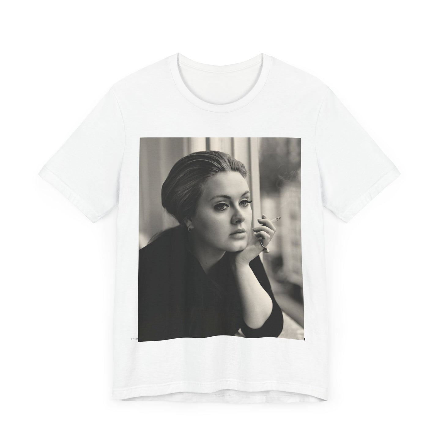 A black graphic t-shirt featuring a black and white photo of Adele, showing her with a serene or thoughtful expression.