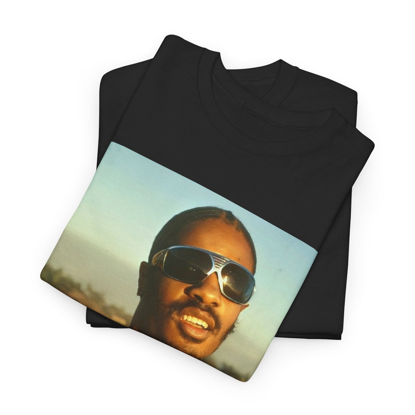 A black graphic t-shirt featuring a 70s cool musical genius graphic of Stevie Wonder.