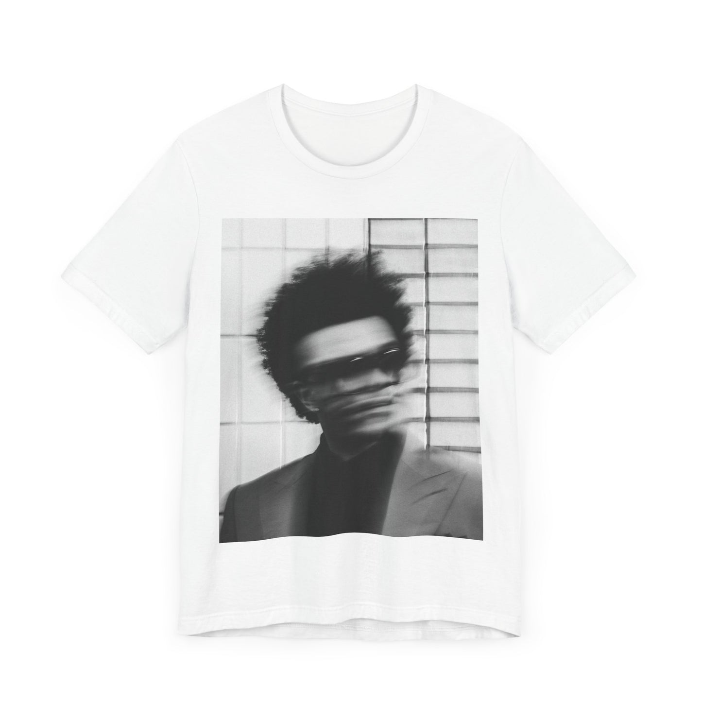 A black graphic t-shirt featuring a blurred graphic of The Weeknd from his 'After Hours' era.