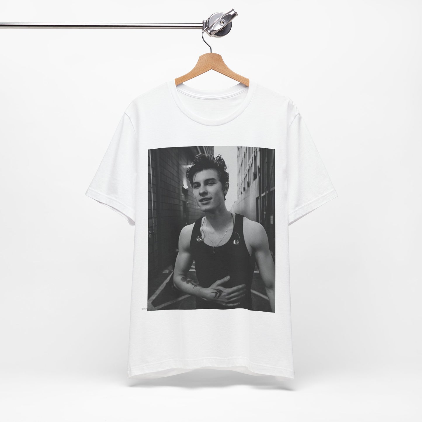 A black graphic t-shirt featuring a vintage black and white portrait graphic or photo of Shawn Mendes.