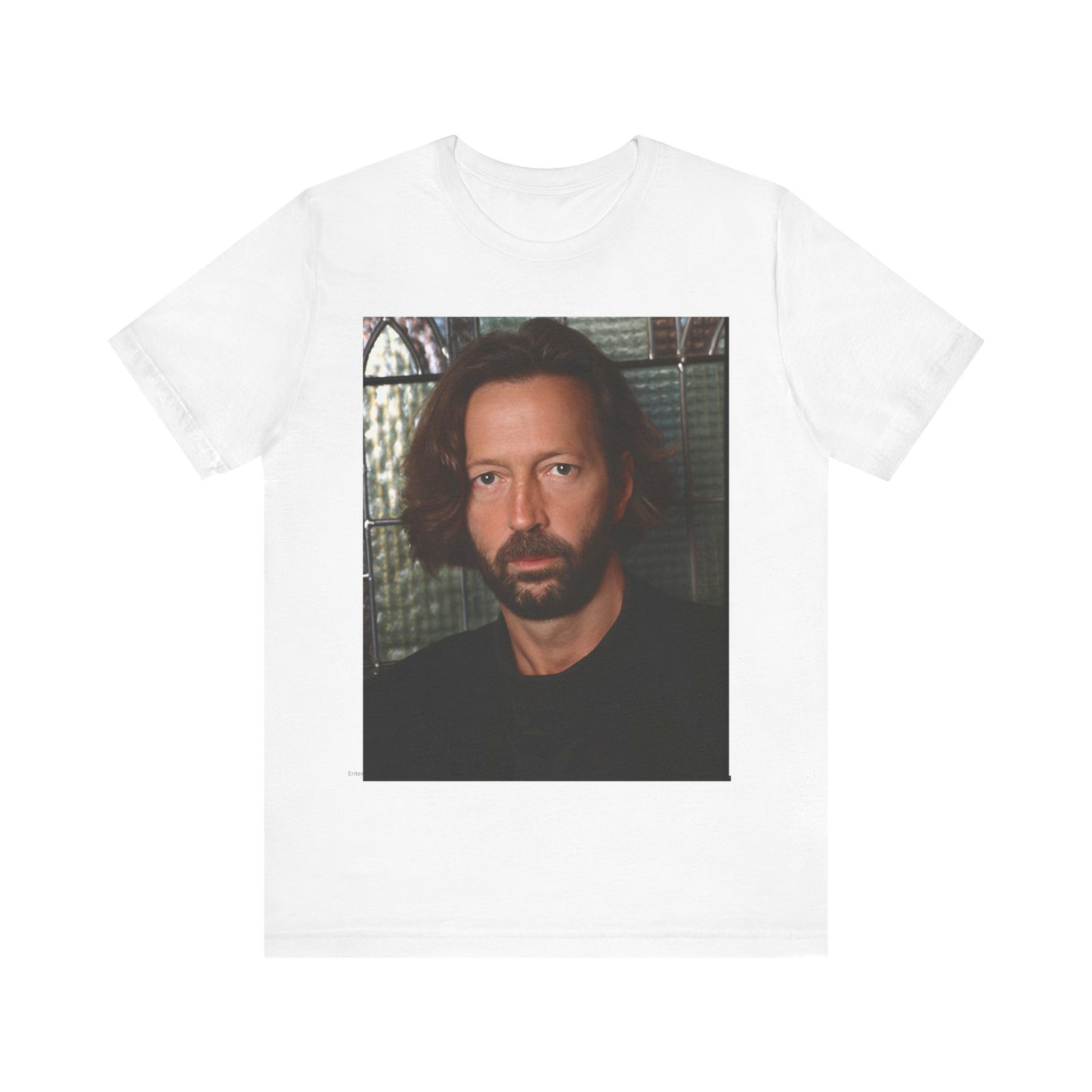A black graphic t-shirt featuring a portrait graphic of Eric Clapton as a guitar god legend.