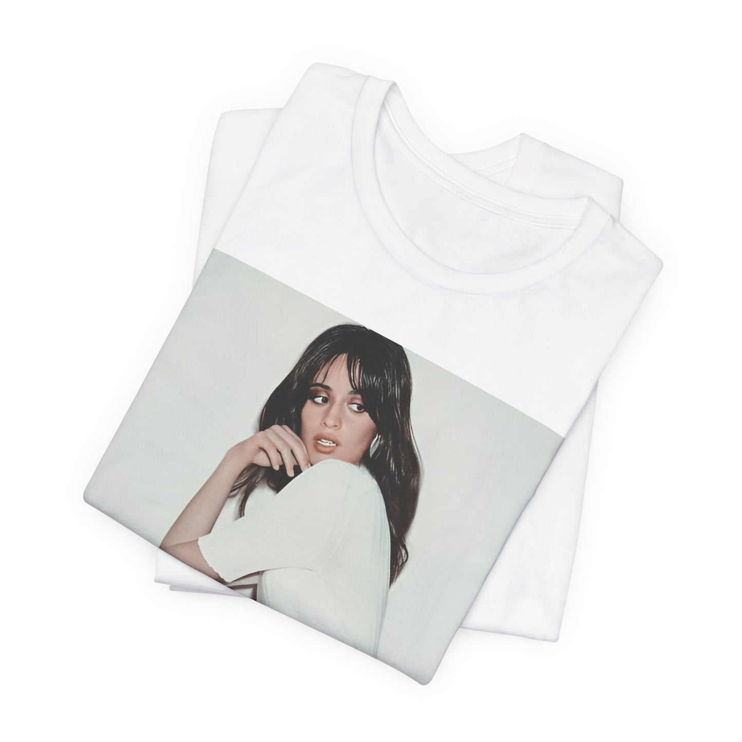 A black graphic t-shirt featuring a stylized graphic of Camila Cabello as a Latin pop princess.