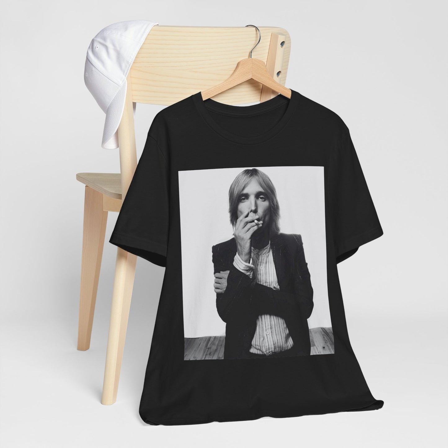 A black graphic t-shirt featuring a black and white graphic or photo of Tom Petty as a Southern rock icon.