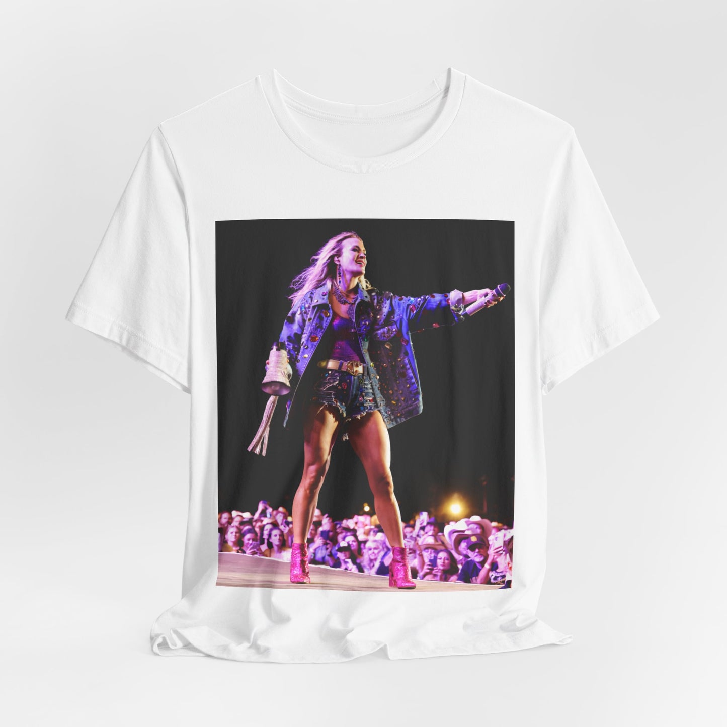 A black graphic t-shirt featuring a graphic of Carrie Underwood with Nashville-themed elements or skyline.