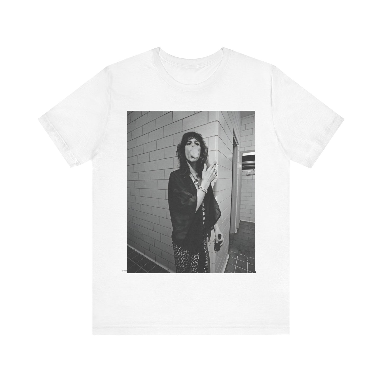 A black graphic t-shirt featuring a retro 70s photo of Aerosmith band members in a backstage setting, showing a candid moment.