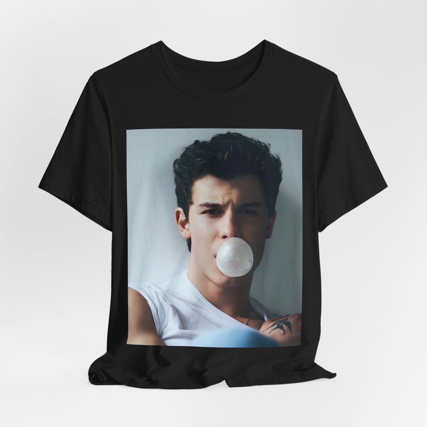 A black graphic t-shirt featuring a photo of Shawn Mendes with a fierce, confident gaze.