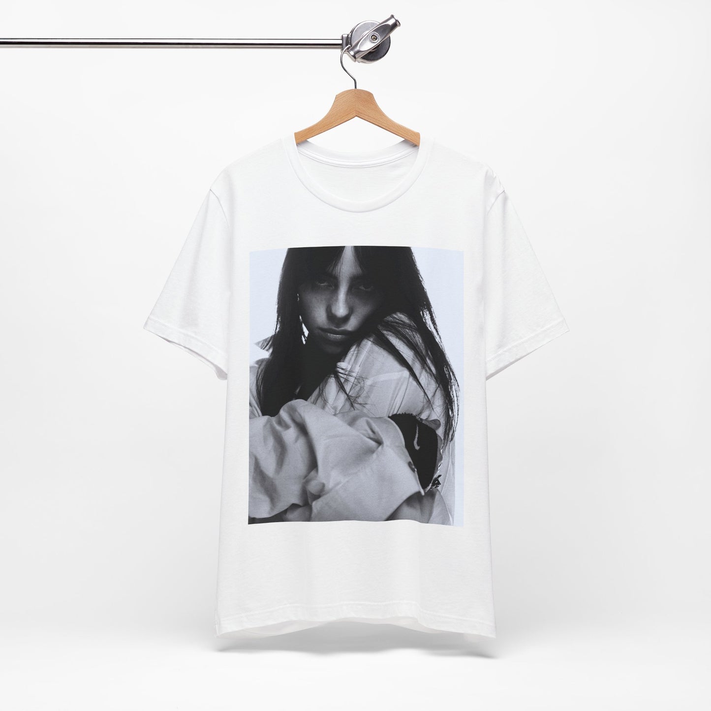 Billie Eilish posing in her signature oversized designer streetwear, printed on a graphic t-shirt.
