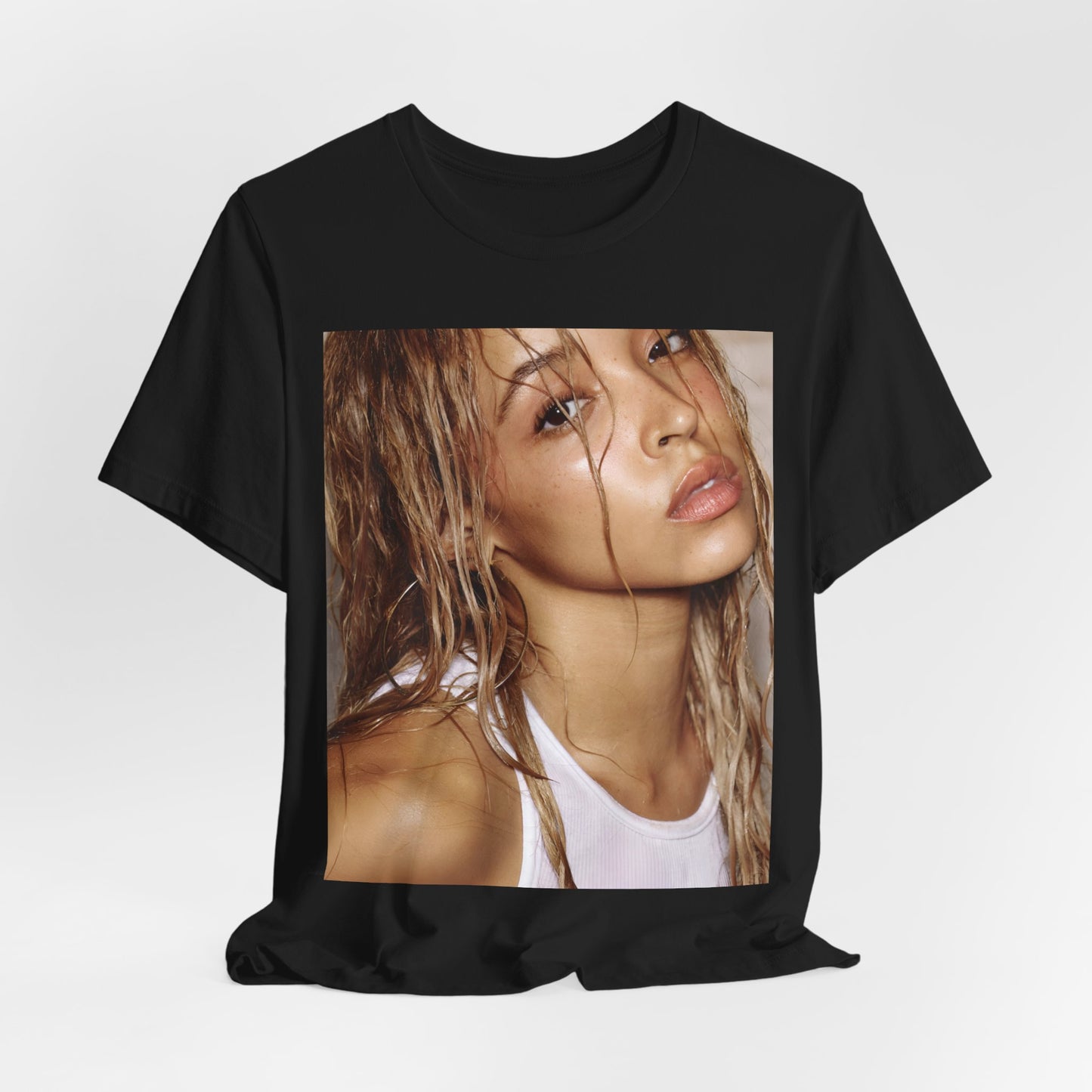 A black graphic t-shirt featuring a nostalgic indie R&B vibes graphic of Tinashe.