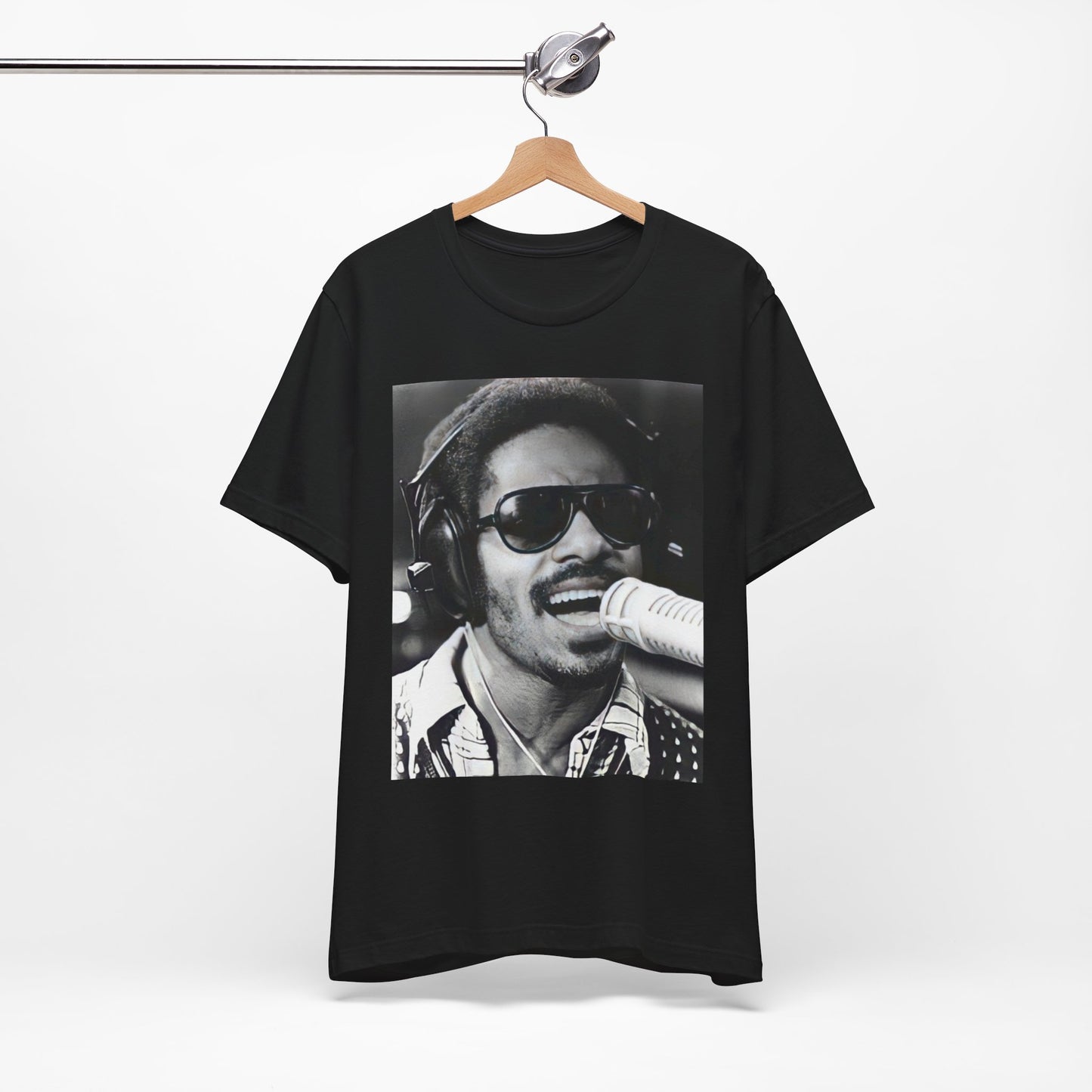 A black graphic t-shirt featuring a graphic of Stevie Wonder as a timeless visionary.