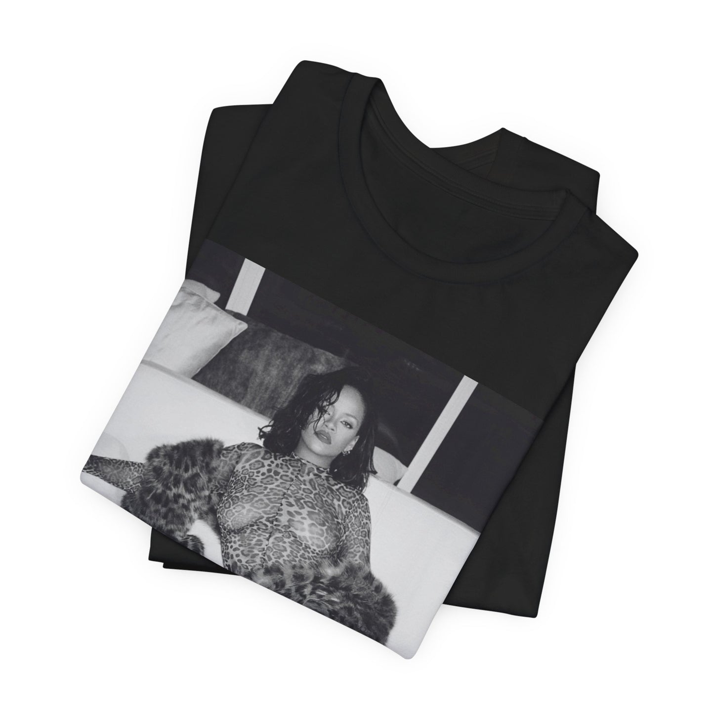 A black graphic t-shirt featuring a black and white, monochrome graphic or photo of Rihanna in a sexy pose.