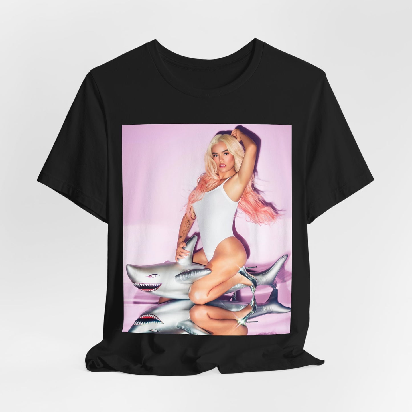 A black graphic t-shirt featuring a stylized graphic of Karol G as a reggaeton diva.