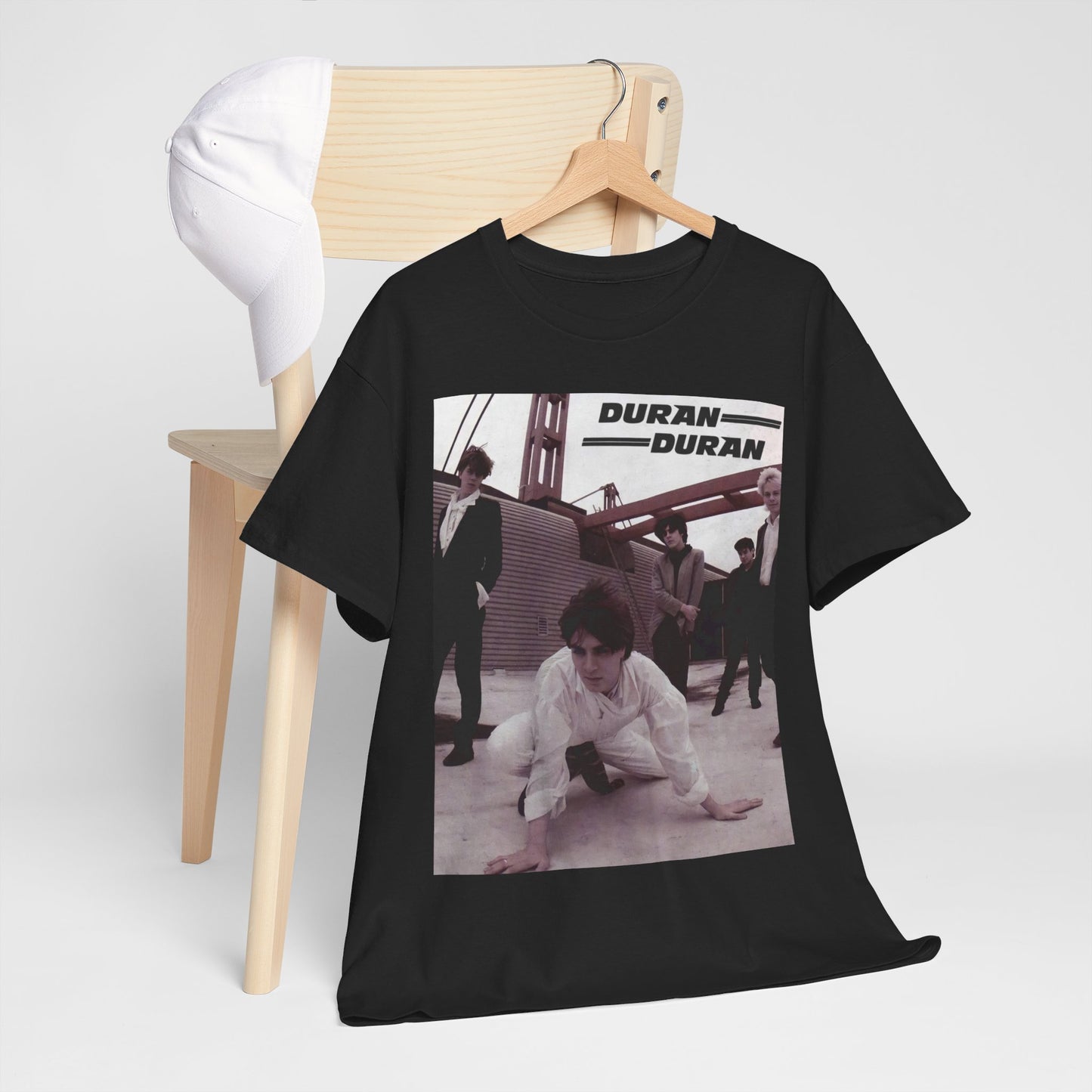 A black graphic t-shirt featuring a graphic related to Duran Duran's 'Hungry Like the Wolf' song or era.