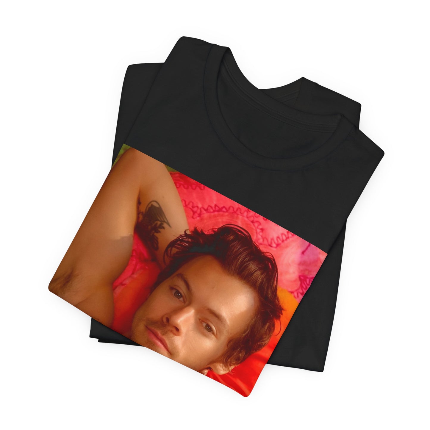 A black graphic t-shirt featuring a graphic of Harry Styles with a chill pop vibe.