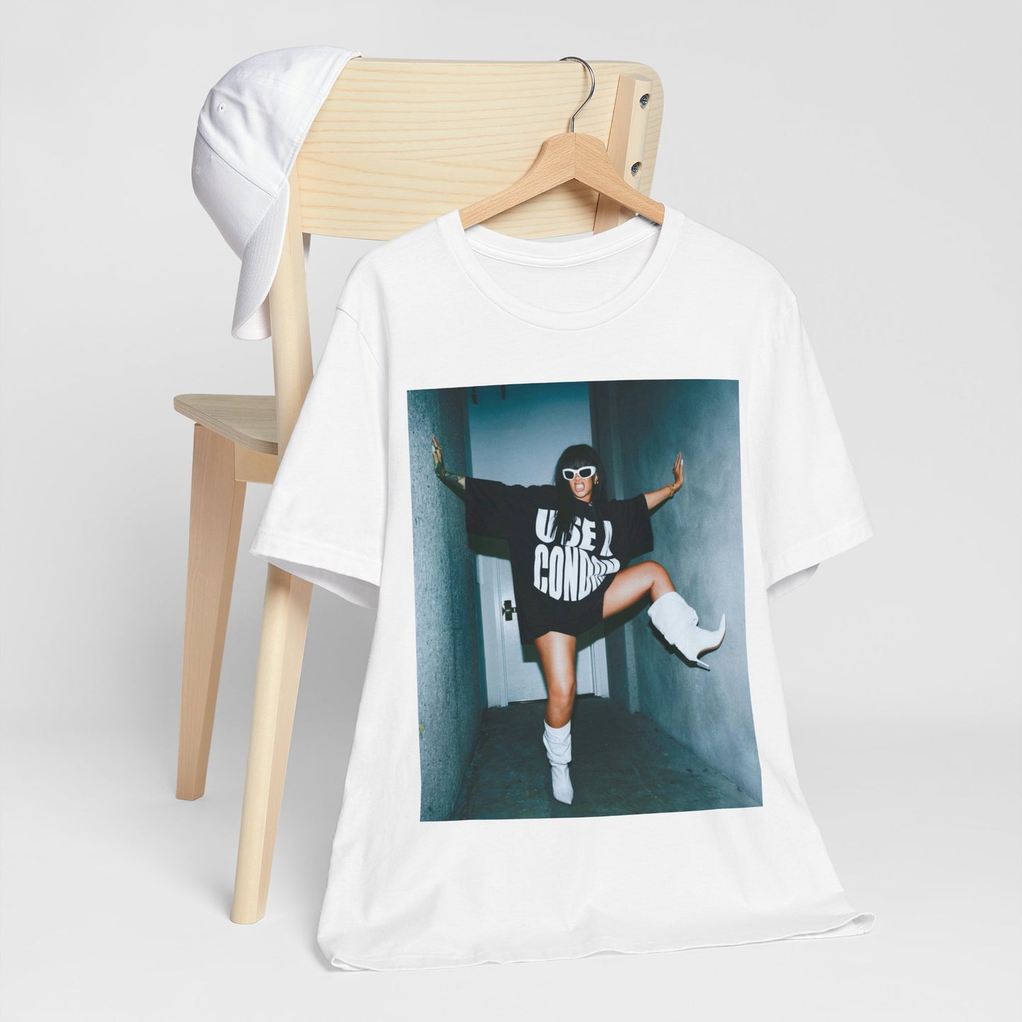 A black graphic t-shirt featuring a modern pop essential graphic of Rihanna.