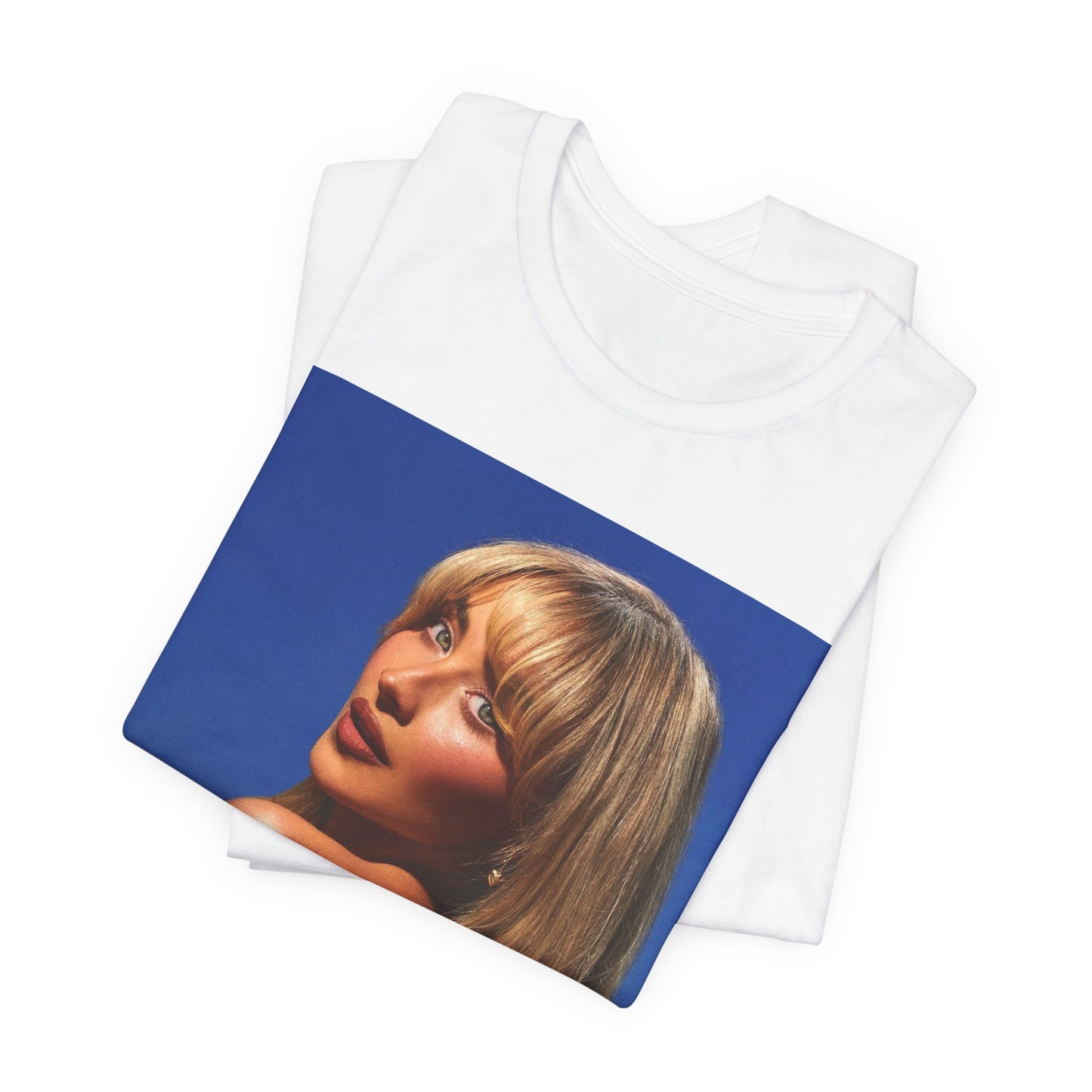 A black graphic t-shirt featuring a stylized graphic of Sabrina Carpenter, designed with a modern pop aesthetic.