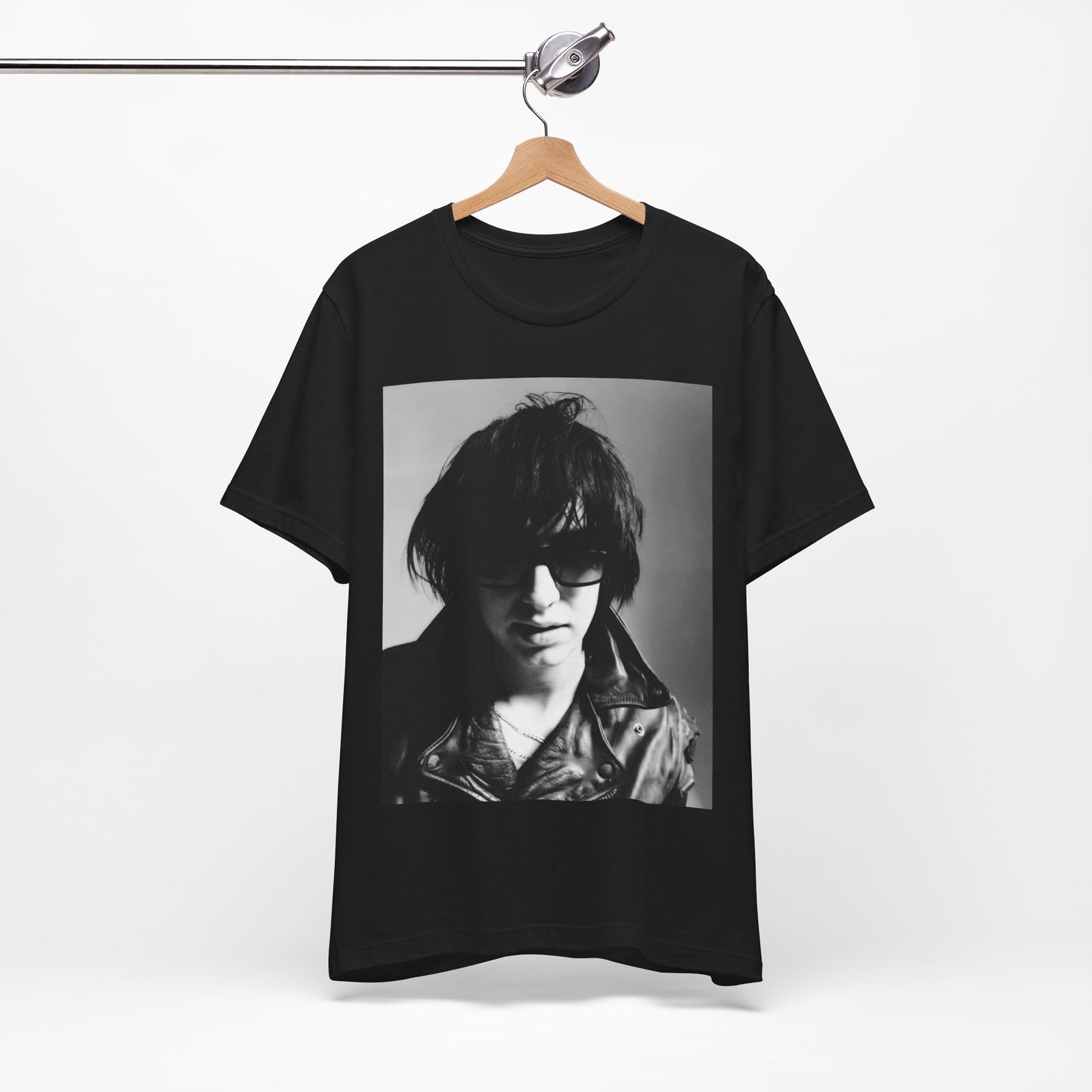 A black graphic t-shirt featuring a graphic related to The Strokes' 'Reptilia' song or era.