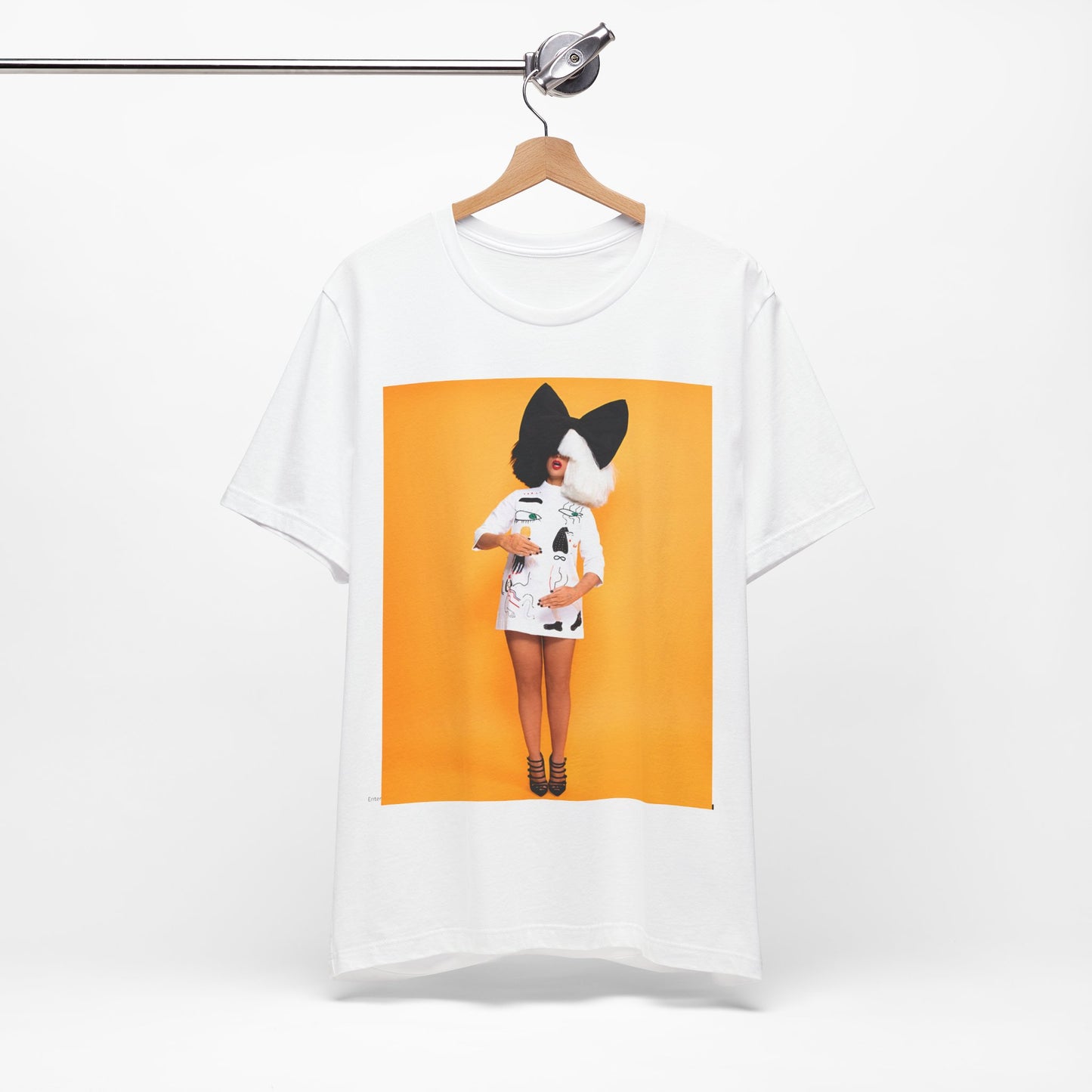 A black graphic t-shirt featuring a graphic of Sia as an art pop visionary.