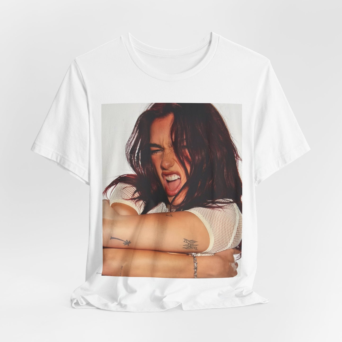 A black graphic t-shirt featuring a bold disco pop graphic of Dua Lipa as a superstar.
