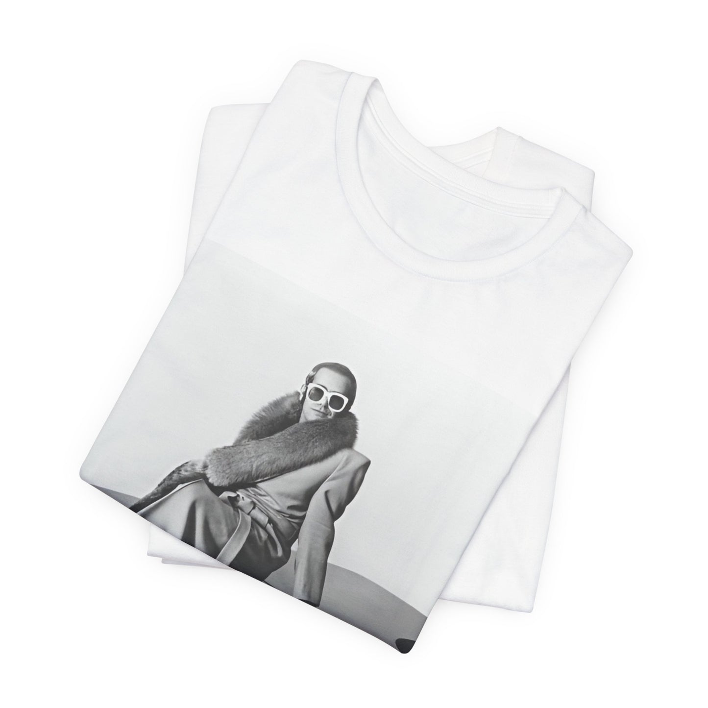 A black graphic t-shirt featuring a black and white photo of Elton John playing the piano.