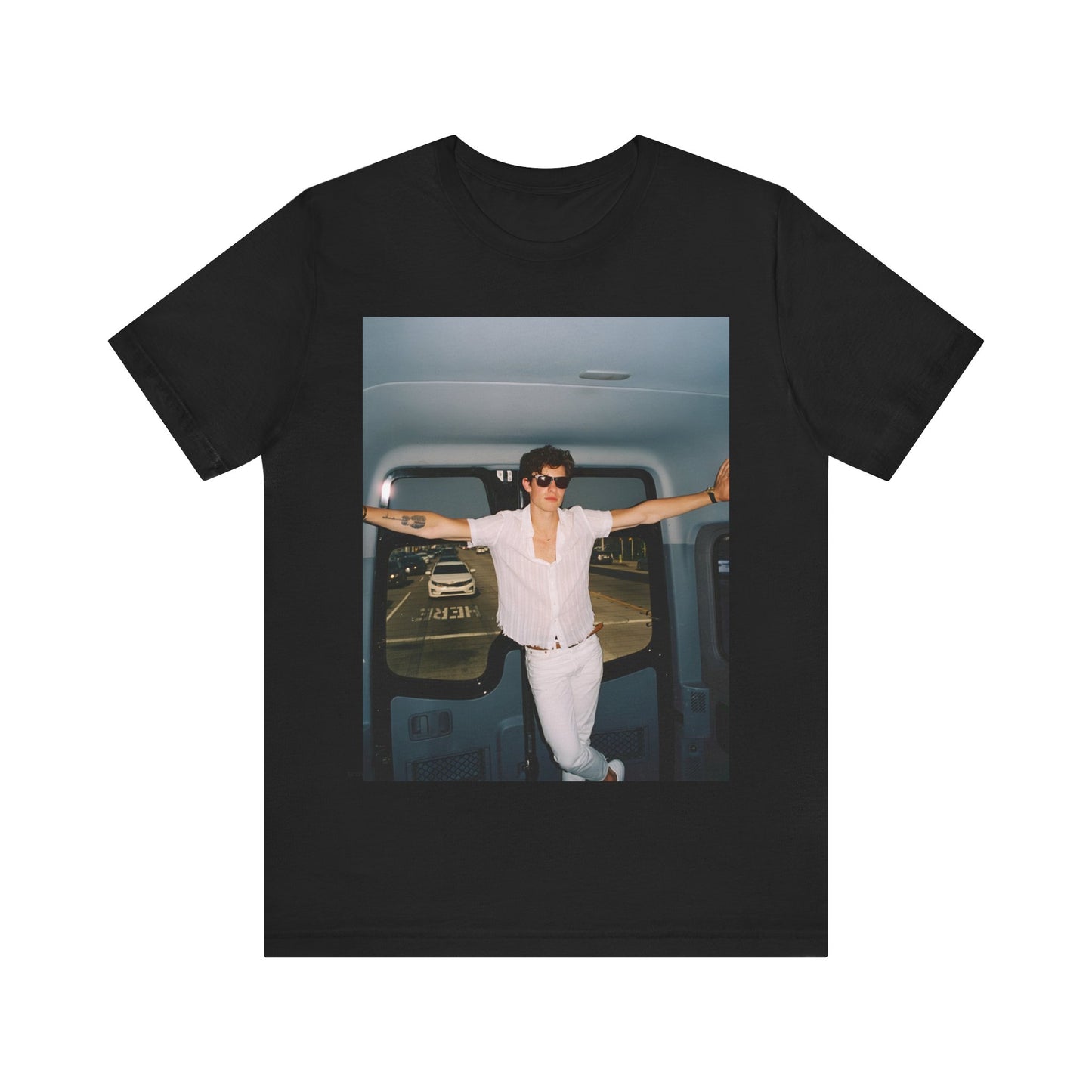 A black graphic t-shirt featuring a graphic of Shawn Mendes with a classic confident look.