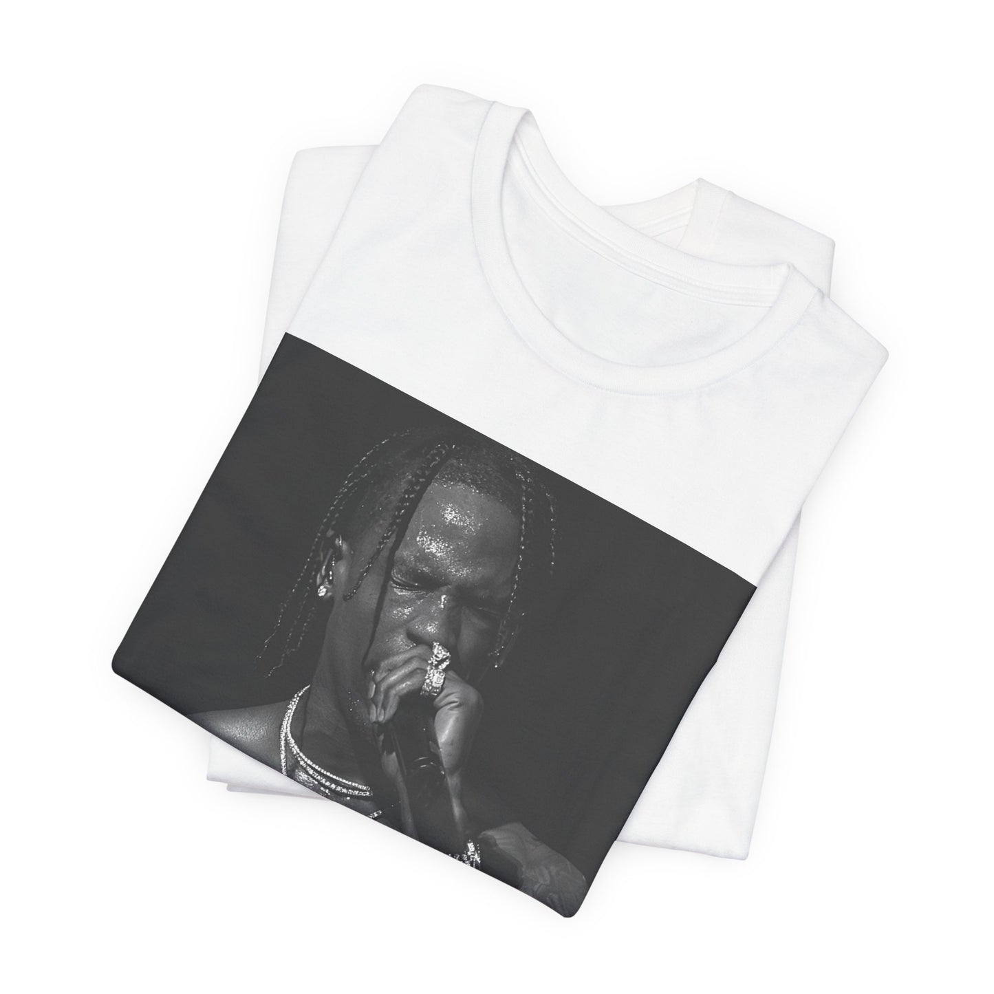 A black graphic t-shirt featuring an underground hip hop graphic of Travis Scott.