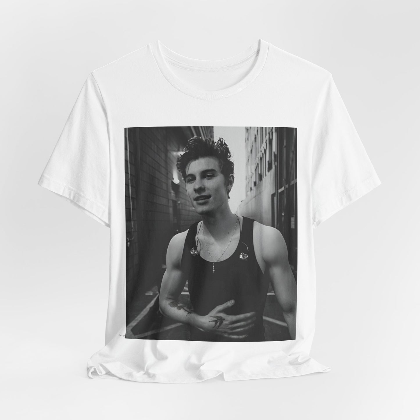 A black graphic t-shirt featuring a vintage black and white portrait graphic or photo of Shawn Mendes.