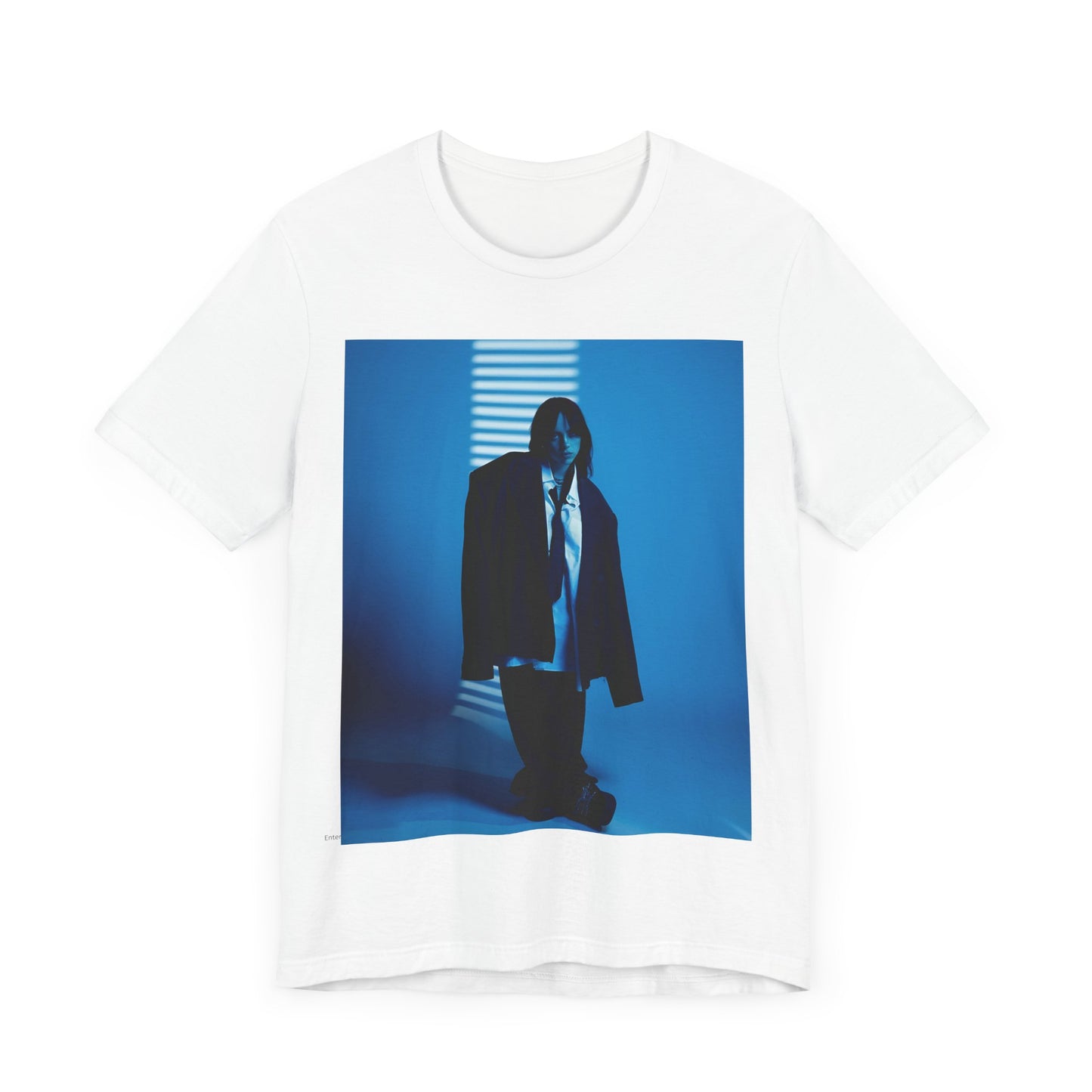 A high-fashion, editorial-style photo of Billie Eilish, embodying a 'breaking the rules' attitude, printed on a graphic t-shirt.