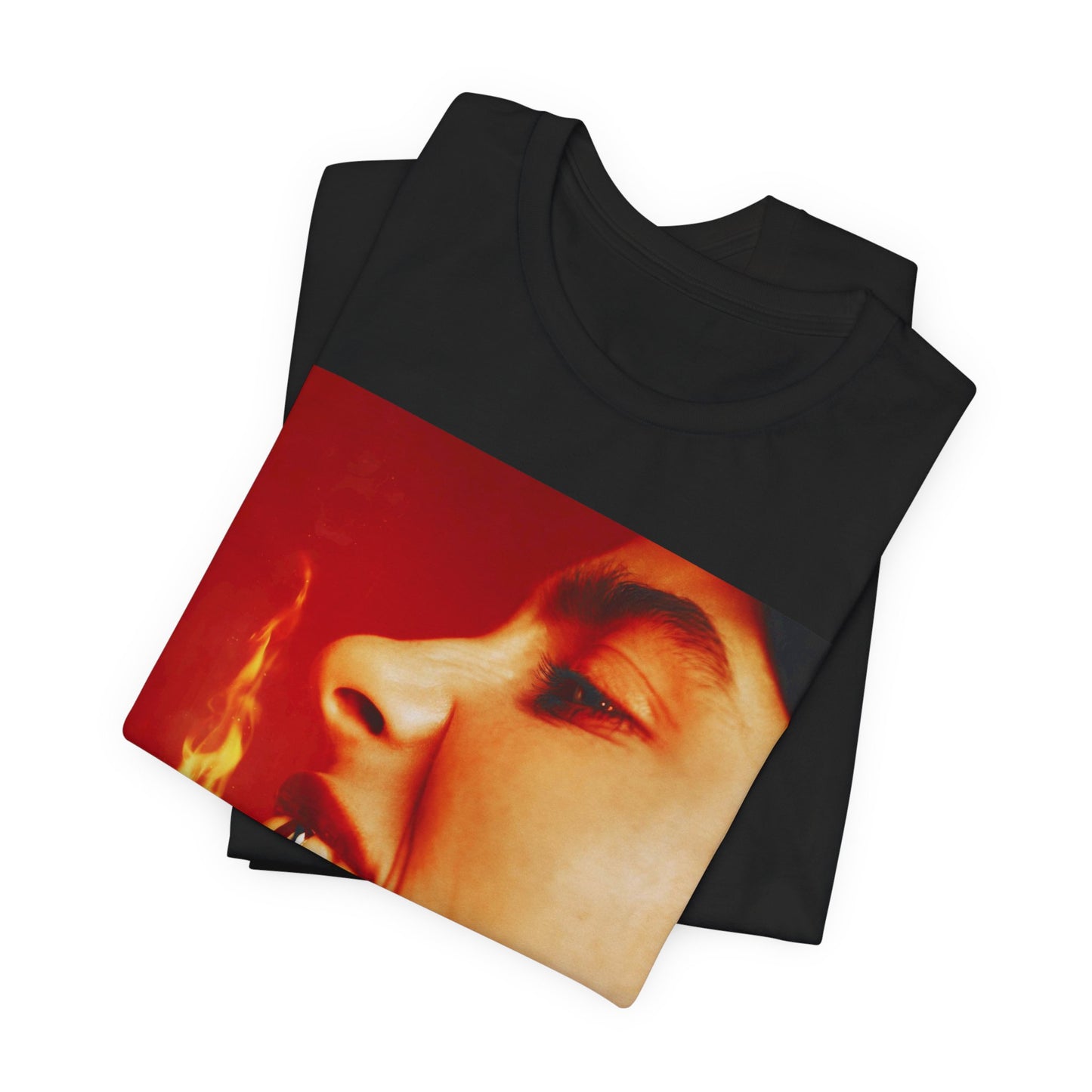 A close-up, red-toned photo of a face in profile with its mouth open and a live flame on the tongue, printed on a graphic t-shirt.
