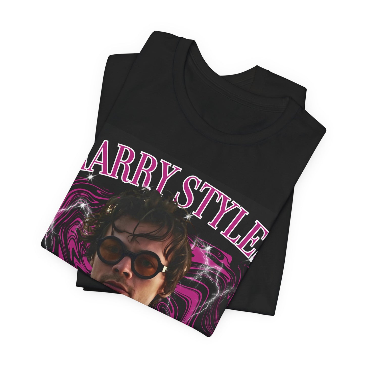 A black graphic t-shirt featuring a bootleg-style pop graphic of Harry Styles.