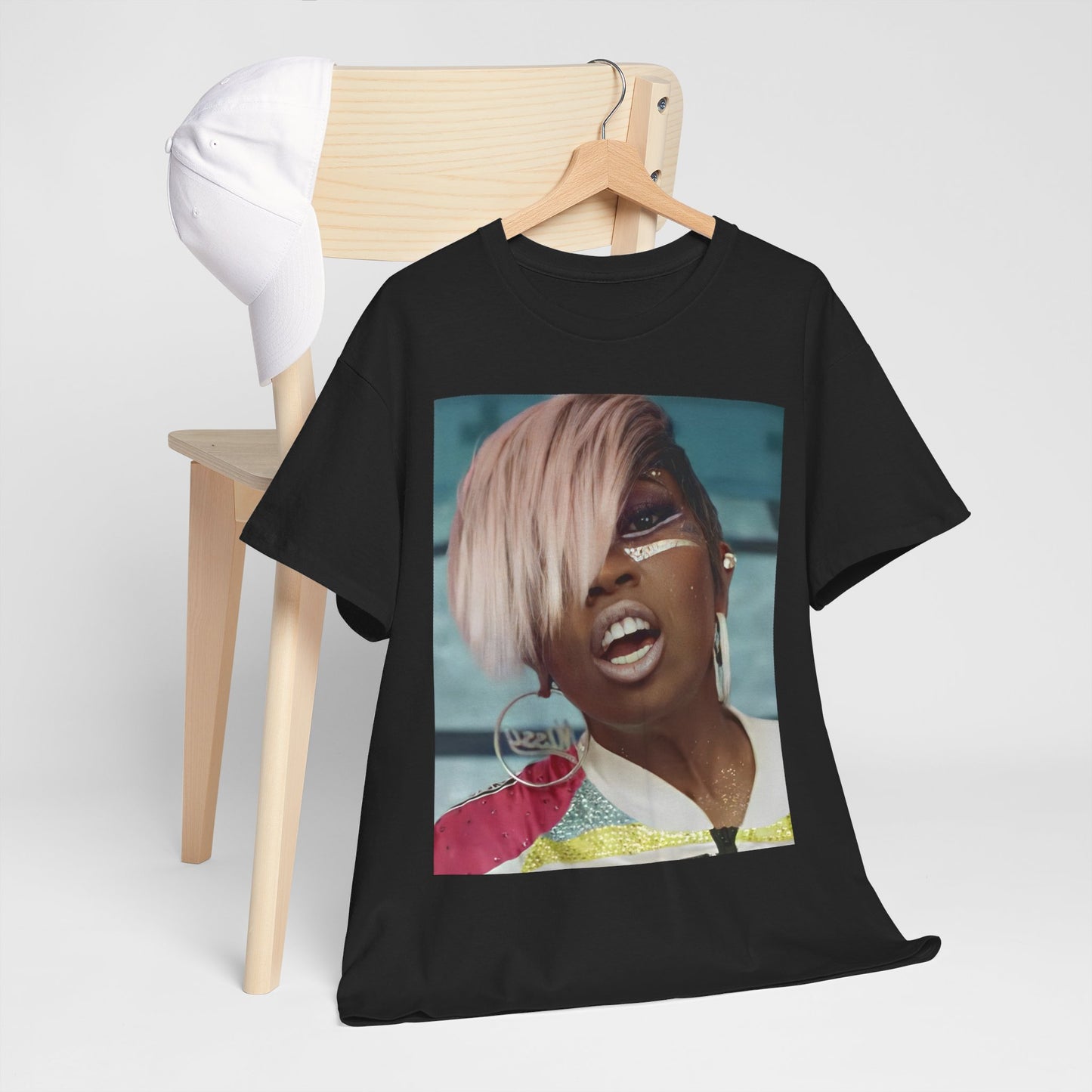 A black graphic t-shirt featuring a classic 90s rap aesthetic graphic of Missy Elliott.