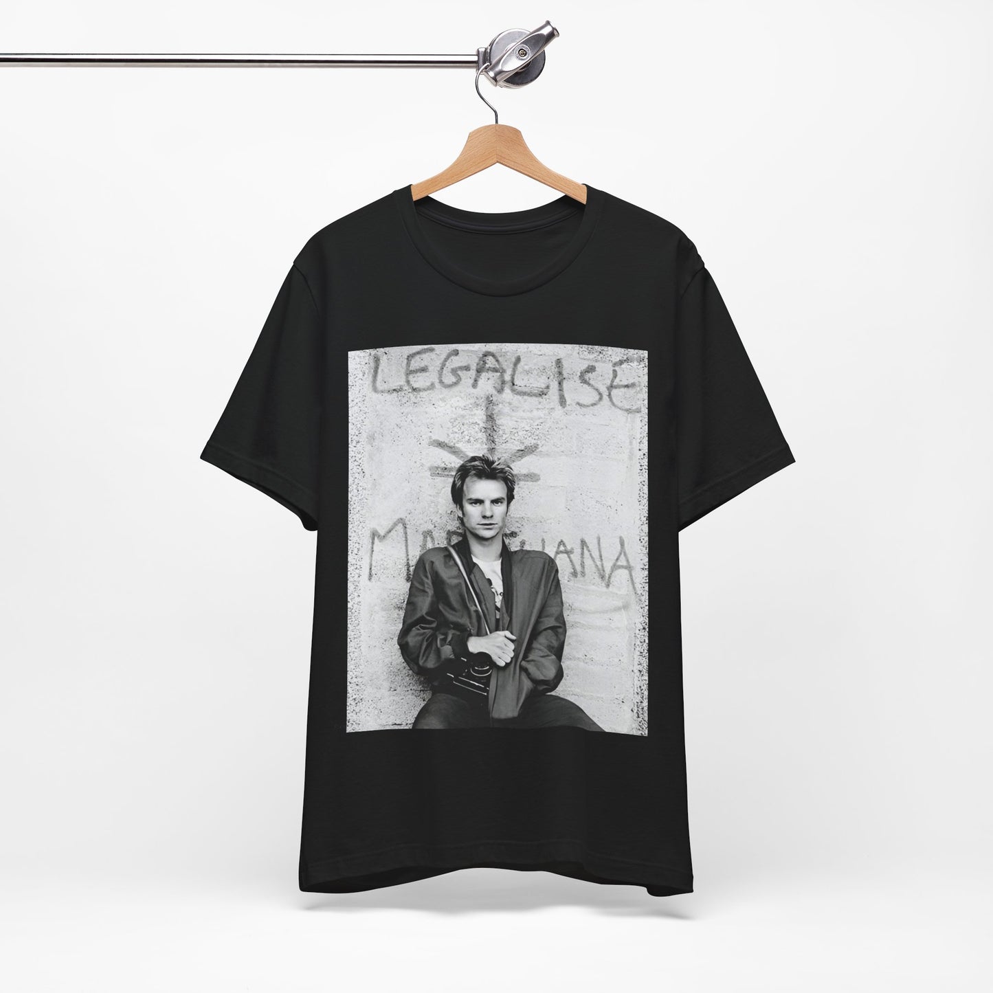 A black graphic t-shirt featuring a graphic of The Police with reggae-influenced pop elements.