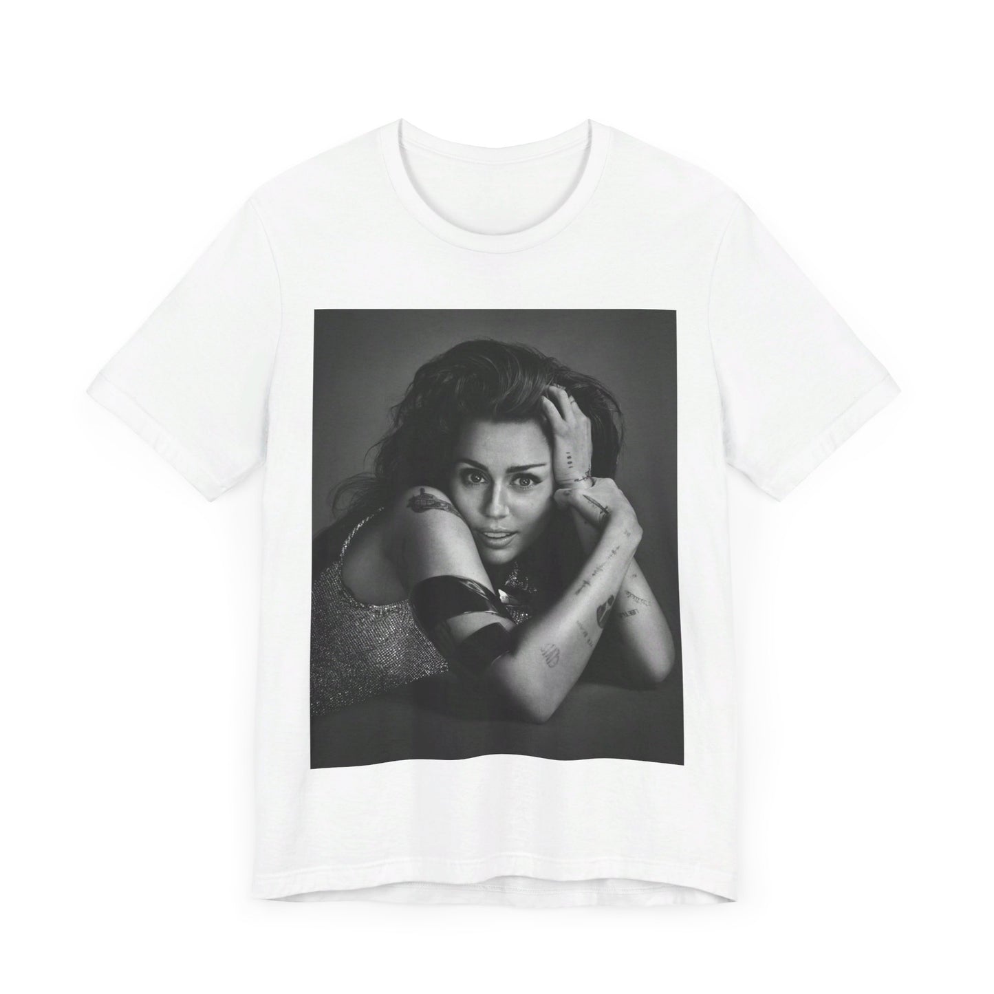 A black graphic t-shirt featuring a black and white portrait graphic of Miley Cyrus.