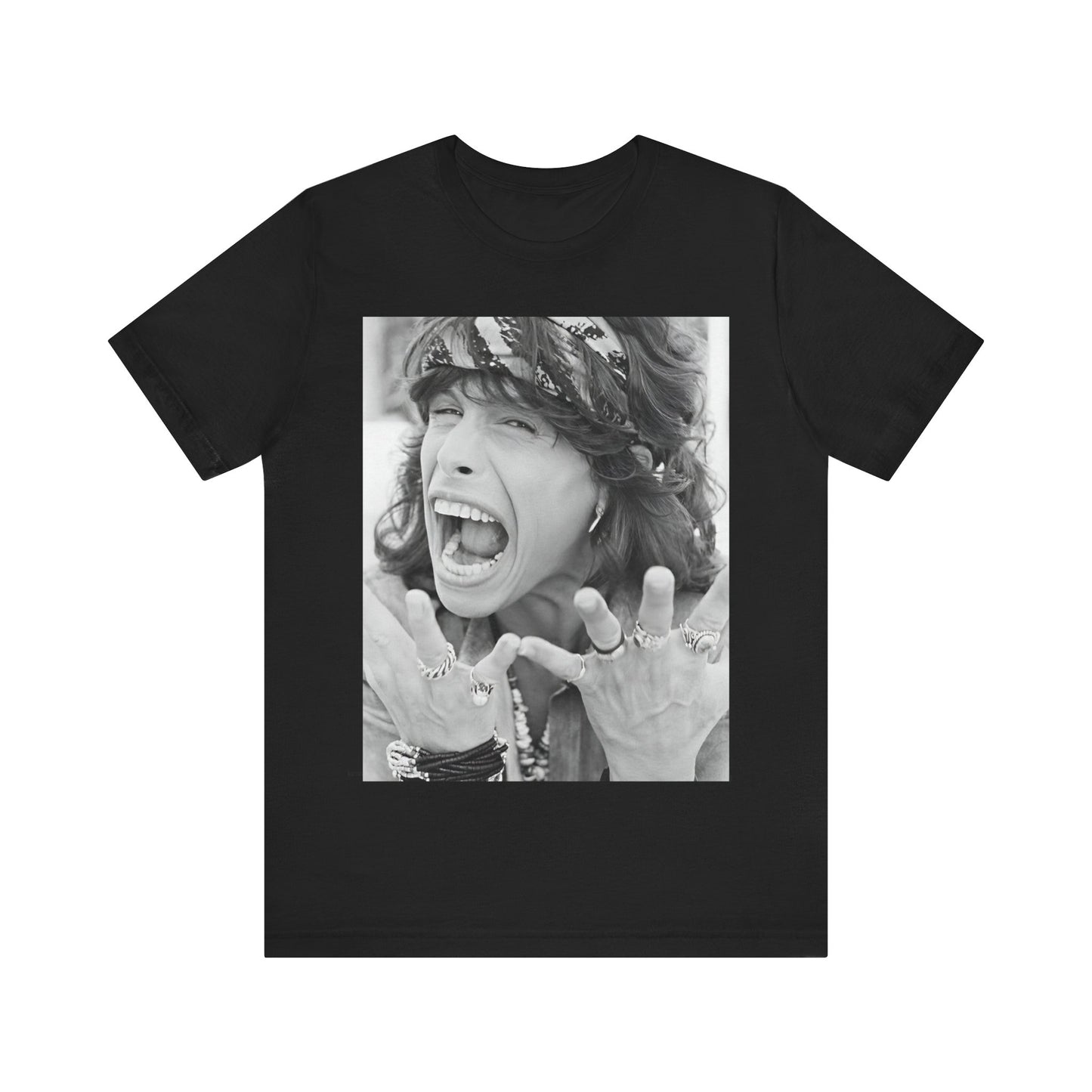 A black graphic t-shirt featuring a candid, dynamic photo of Aerosmith band members on tour in the 1970s, possibly showing action or interaction on stage or backstage.