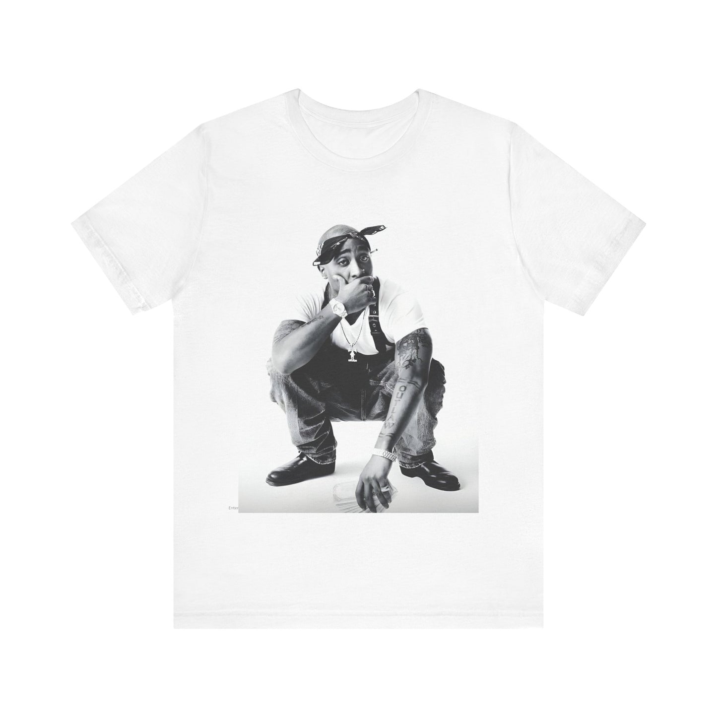 A black graphic t-shirt featuring a graphic of Tupac with a conscious rap vibe.