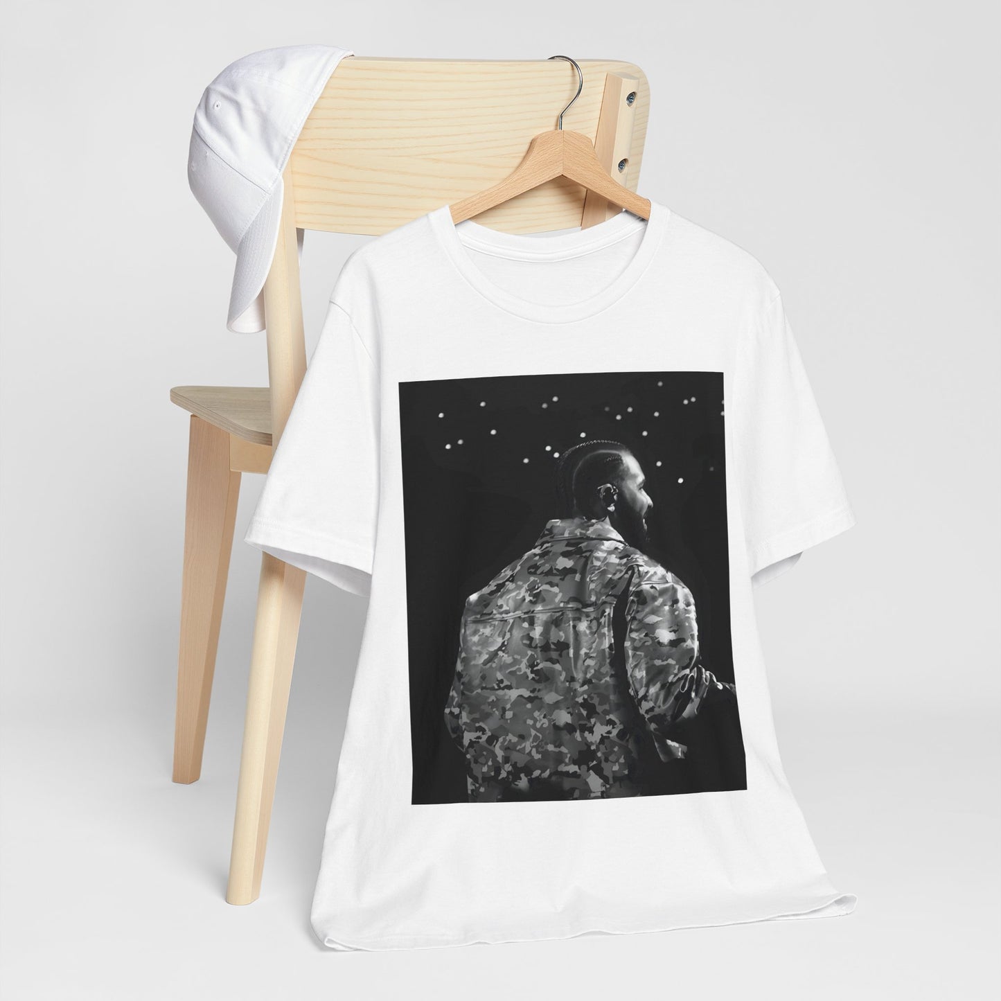 A black graphic t-shirt featuring a black and white graphic or photo of Drake performing live on stage.