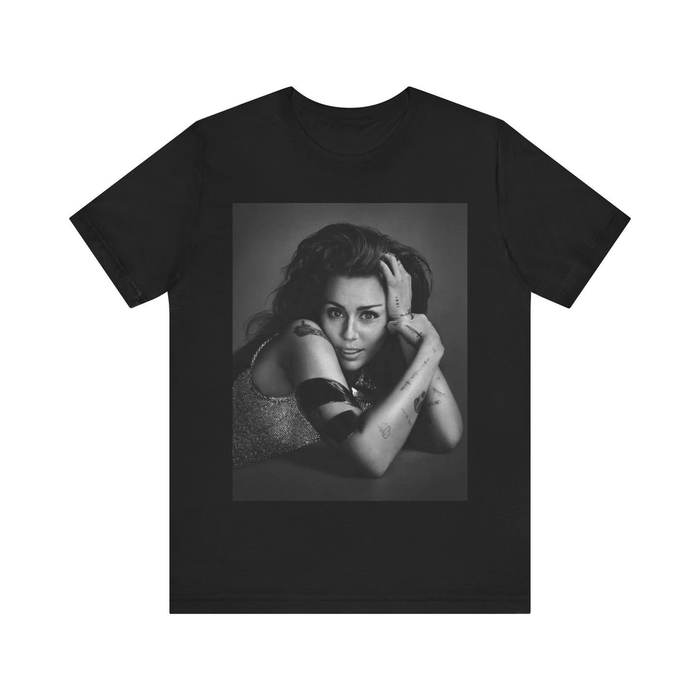 A black graphic t-shirt featuring a black and white portrait graphic of Miley Cyrus.