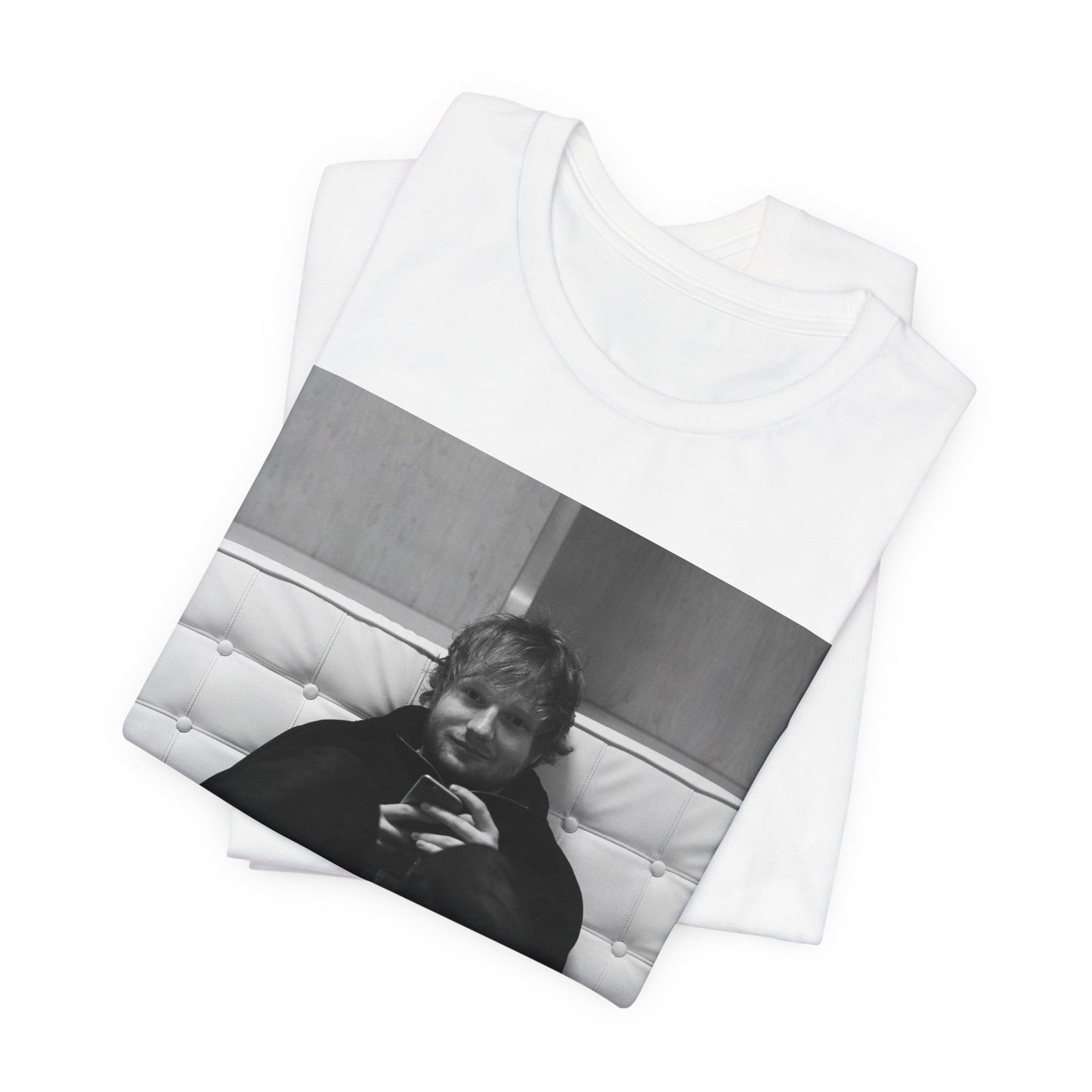 A black graphic t-shirt featuring a bold black and white graphic of Ed Sheeran.