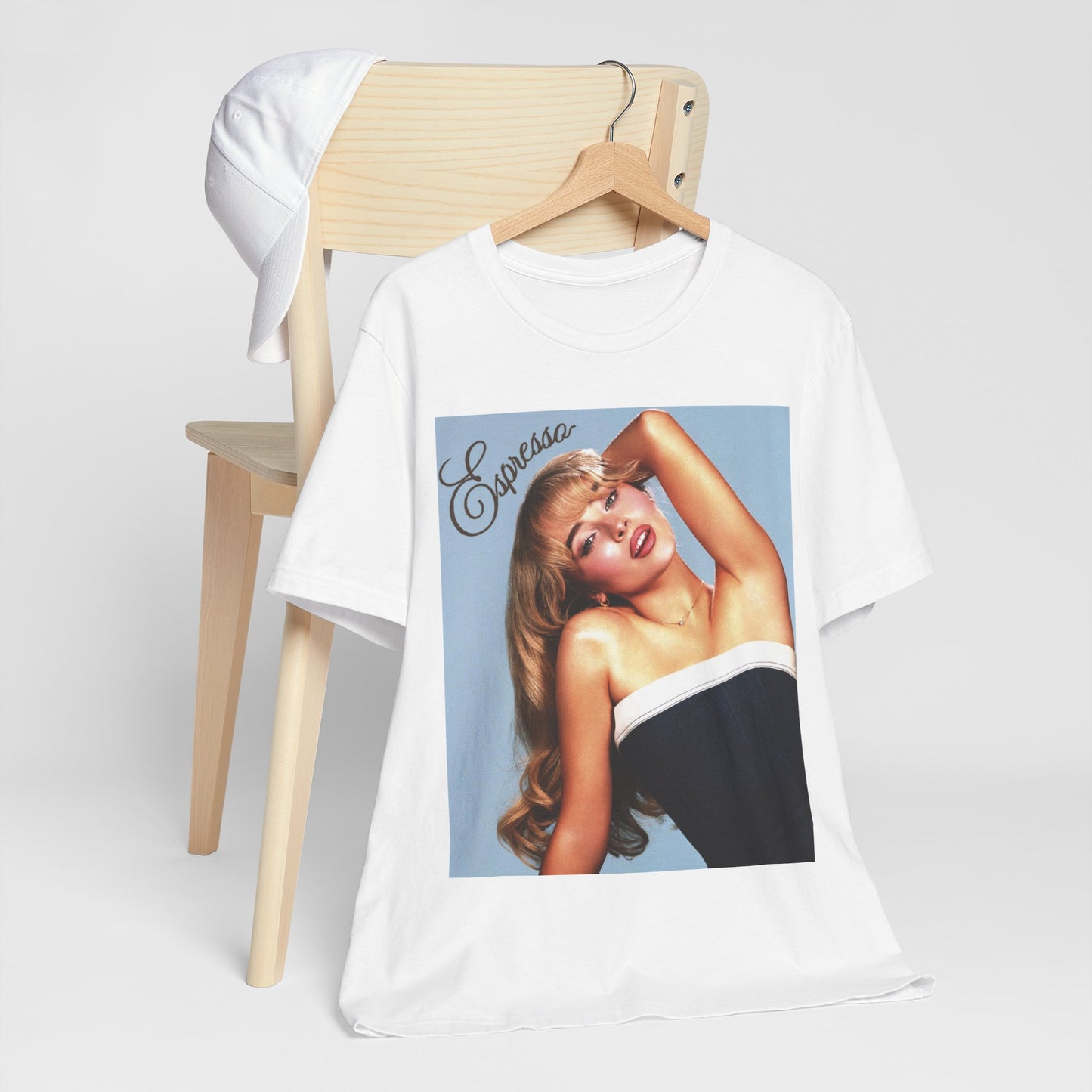 A black graphic t-shirt featuring a graphic related to Sabrina Carpenter's 'Espresso' song.