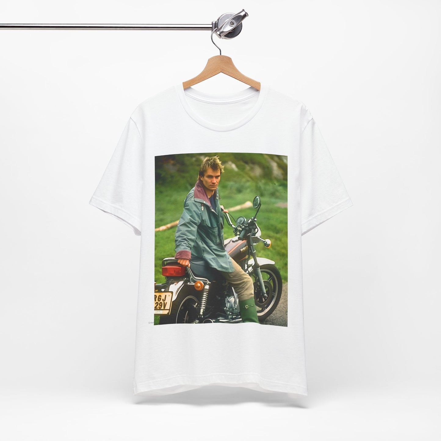 A black graphic t-shirt featuring a graphic of Sting from The Police with a motorcycle theme.