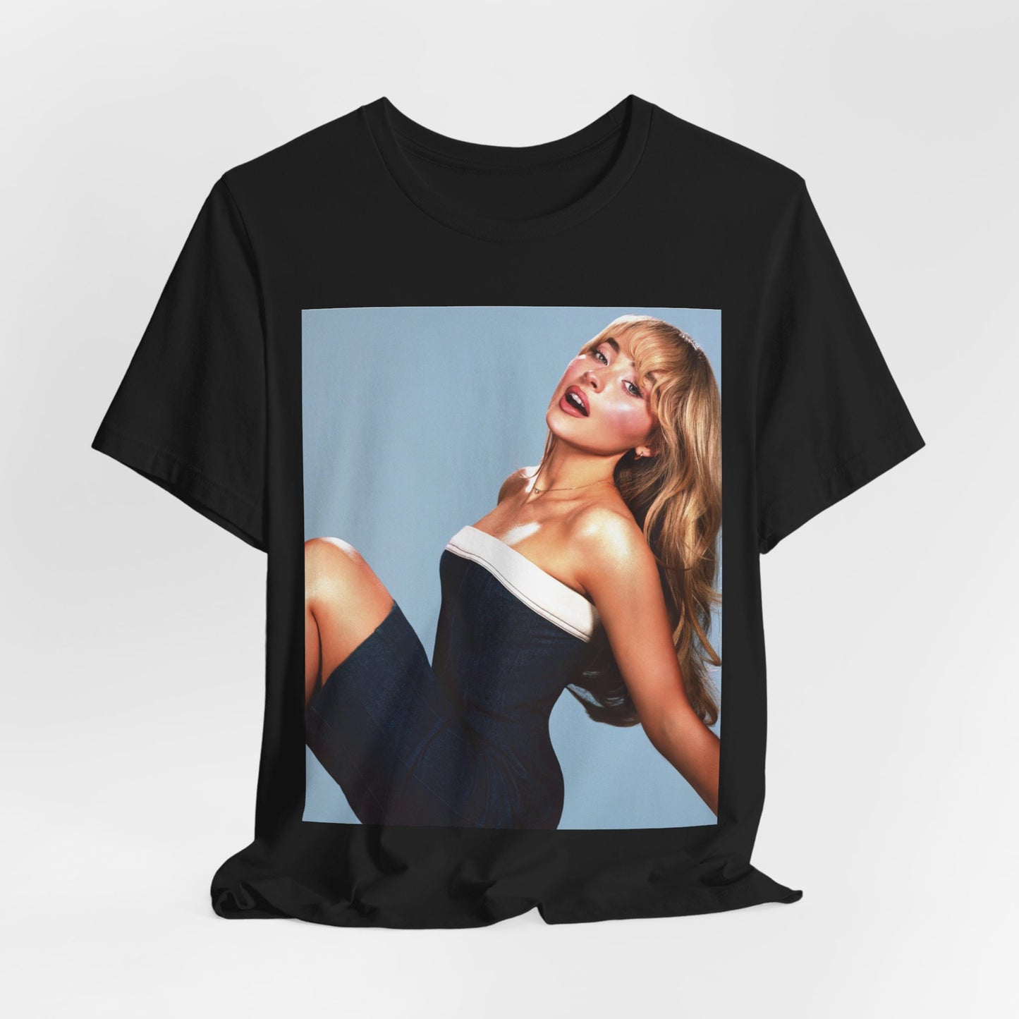 A black graphic t-shirt featuring a graphic related to Sabrina Carpenter's 'Espresso' song or era.