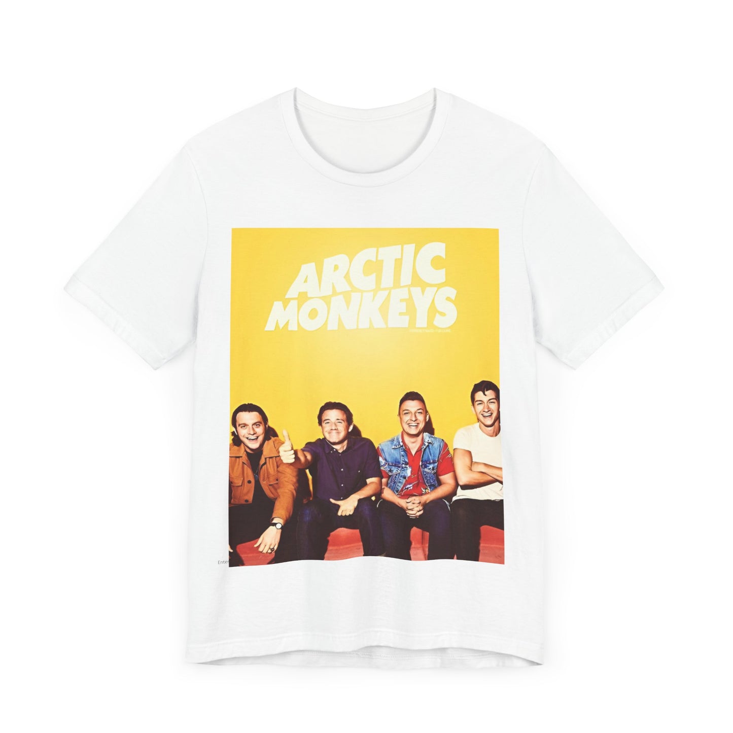 A black graphic t-shirt featuring a bold, vintage-style graphic for the Arctic Monkeys, possibly with abstract elements or stylized band imagery.