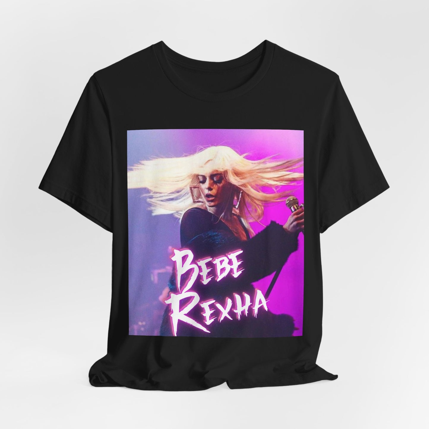 A black graphic t-shirt featuring a dynamic graphic or photo of Bebe Rexha performing live in concert.