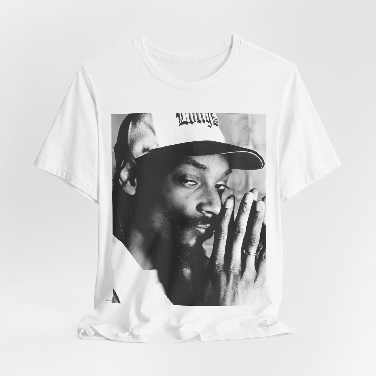 A black graphic t-shirt featuring a cool black and white graphic or photo of Snoop Dogg as a rapper.