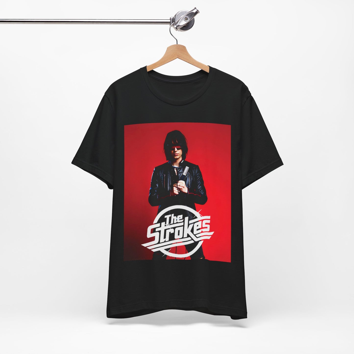 A black graphic t-shirt featuring a bold indie rock superstar graphic of The Strokes.